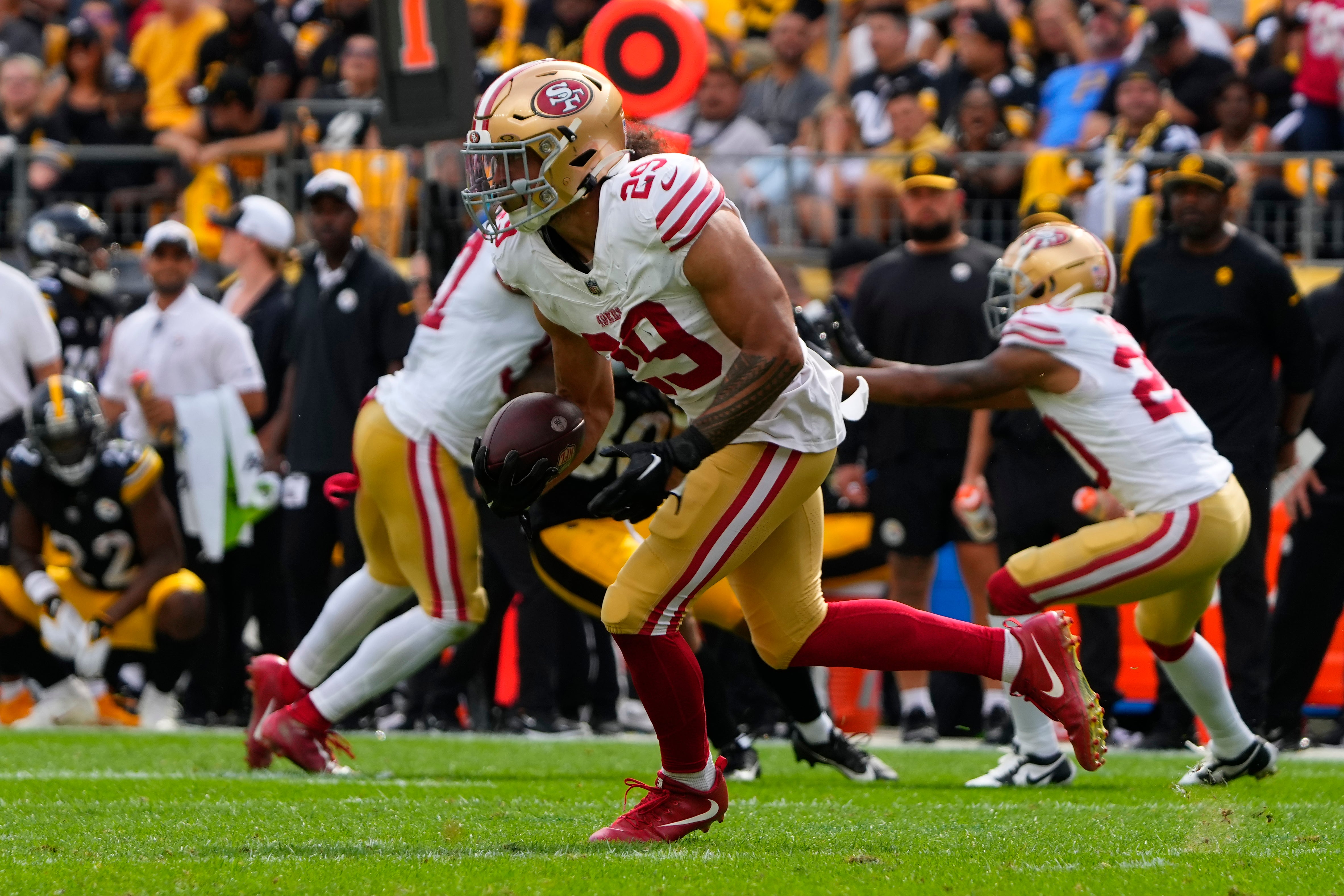 Sep 10, 2023; Pittsburgh, Pennsylvania, USA; San Francisco 49ers safety Talanoa Hufanga (29) runs with the ball after intercepting a pass against the Pittsburgh Steelers during the second half at Acrisure Stadium. Mandatory Credit: Gregory Fisher-USA TODAY Sports