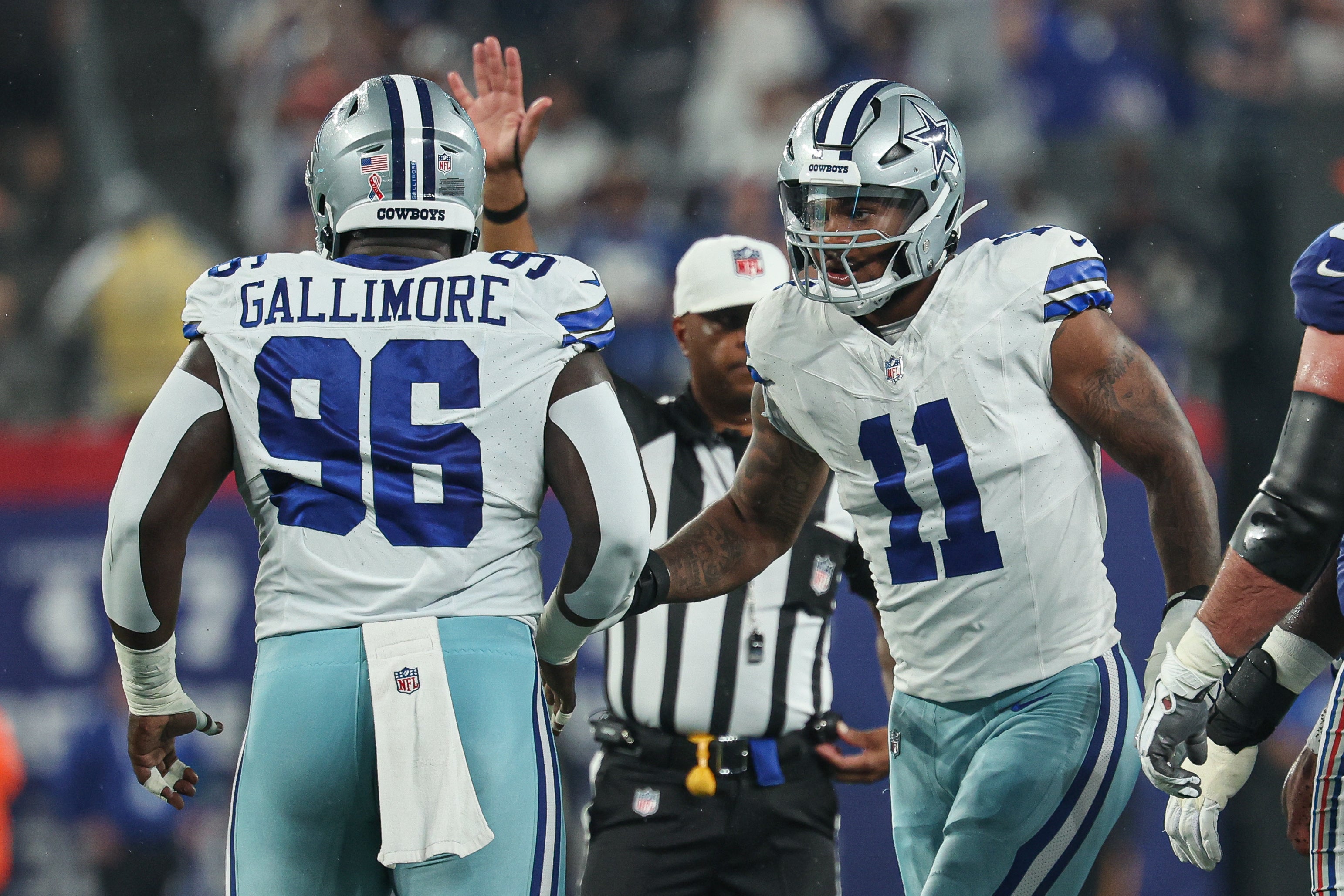 Dallas Cowboys linebacker Micah Parsons (11) celebrates a defensive stop with defensive tackle Neville Gallimore (96) during the first quarter against the New York Giants at MetLife Stadium. Mandatory Credit: Vincent Carchietta-USA TODAY Sports