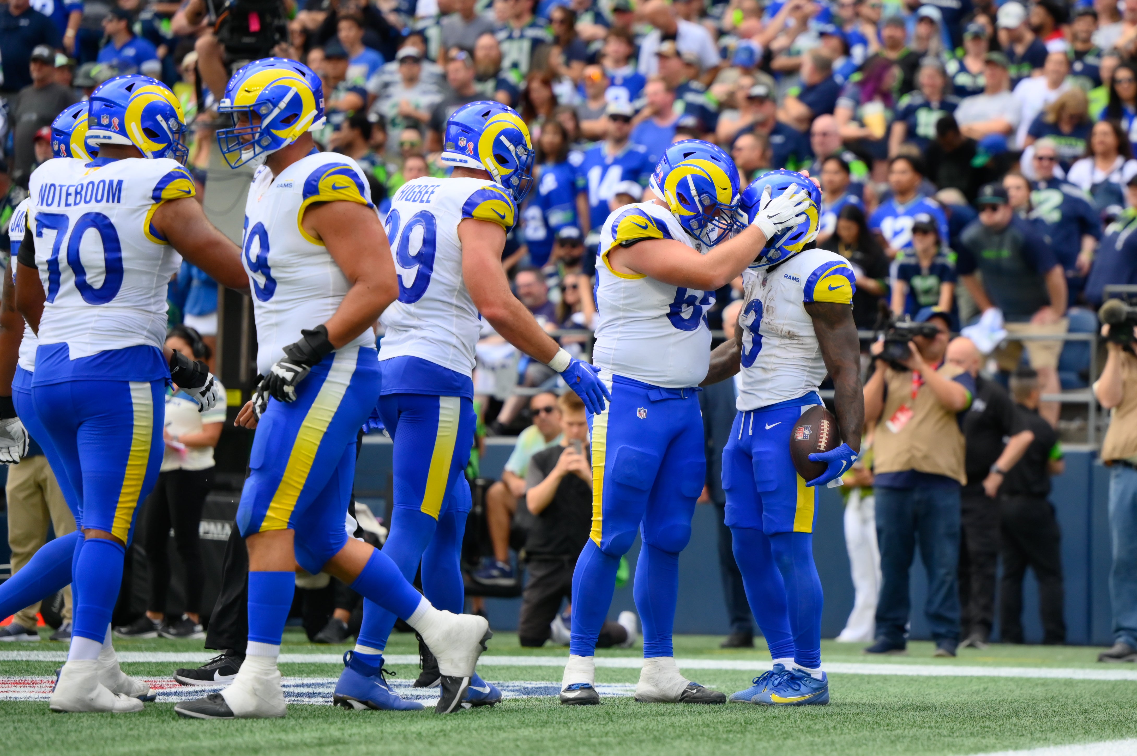 Sep 10, 2023; Seattle, Washington, USA; Los Angeles Rams guard Coleman Shelton (65) and Los Angeles Rams running back Cam Akers (3) celebrate after Akers scored a touchdown against the Seattle Seahawks during the second half at Lumen Field. Mandatory Credit: Steven Bisig-USA TODAY Sports