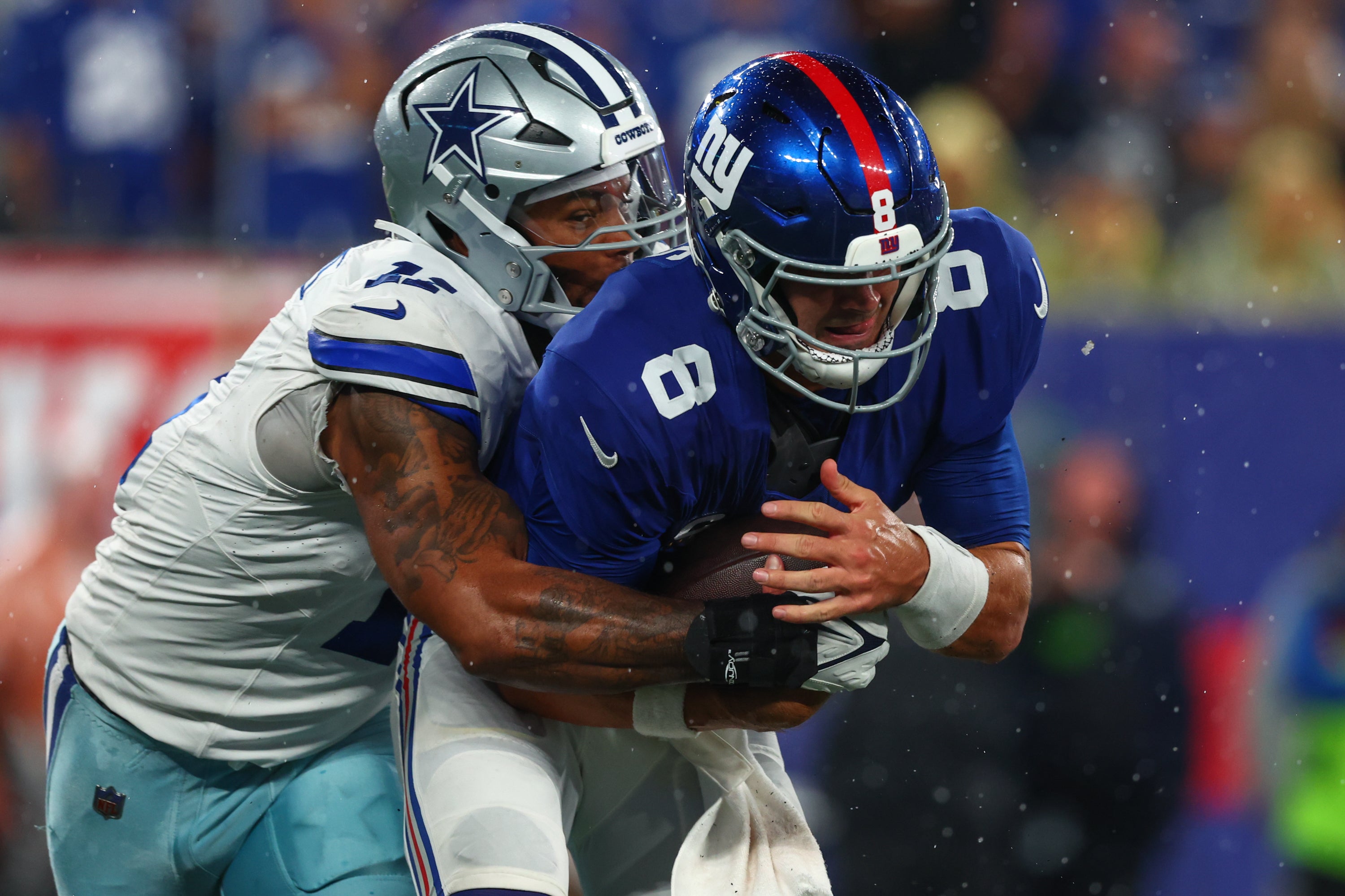 New York Giants quarterback Daniel Jones (8) is sacked by Dallas Cowboys linebacker Micah Parsons (11) during the first half at MetLife Stadium. Mandatory Credit: Ed Mulholland-USA TODAY Sports
