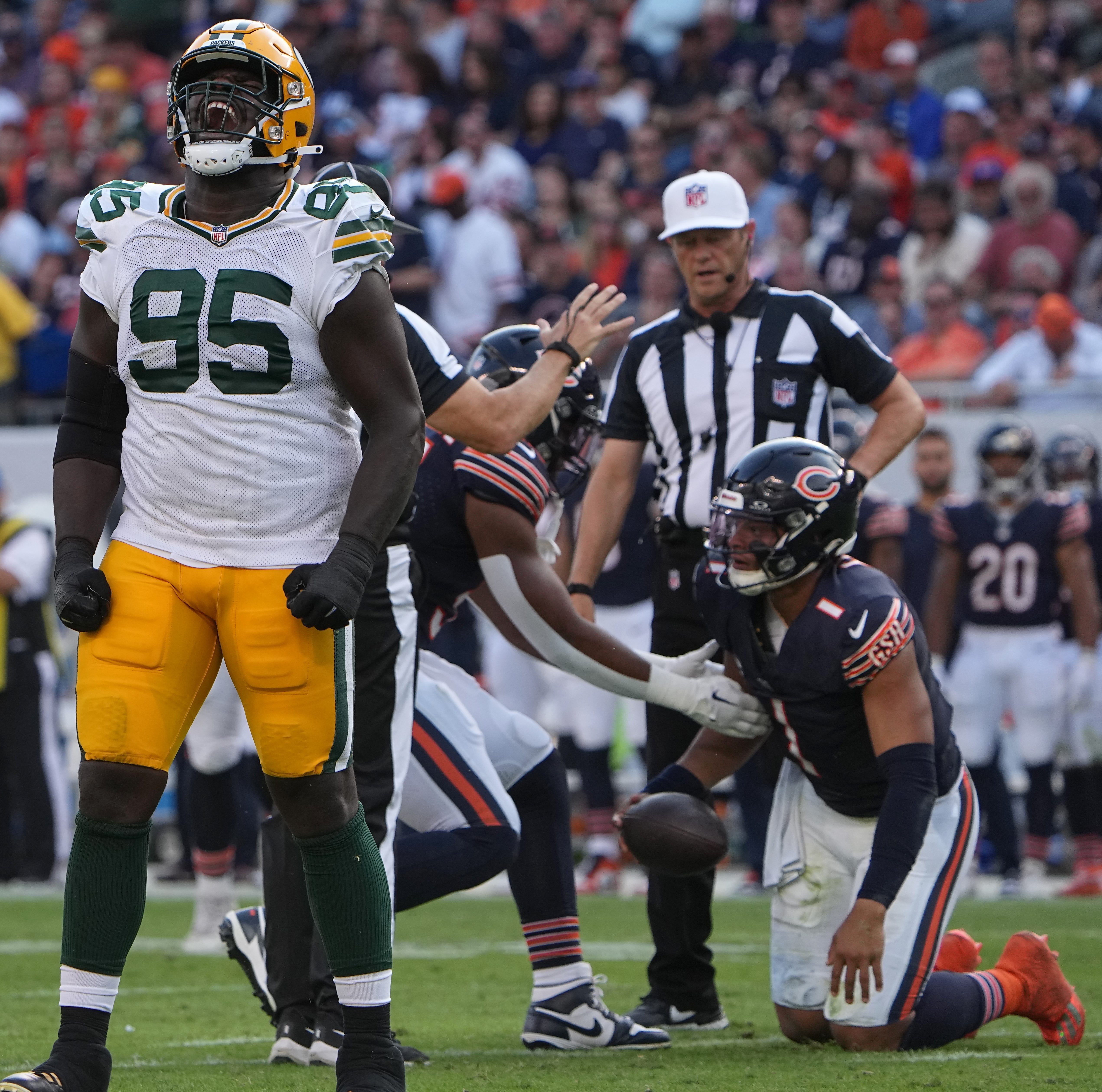 Green Bay Packers defensive tackle Devonte Wyatt (95) celebrates his sack of Chicago Bears quarterback Justin Fields (1) during the third quarter of their regular season opening game Sunday, September 10, 2023 at Soldier Field in Chicago, Ill. The Green Bay Packers beat the Chicago Bears 38-20.