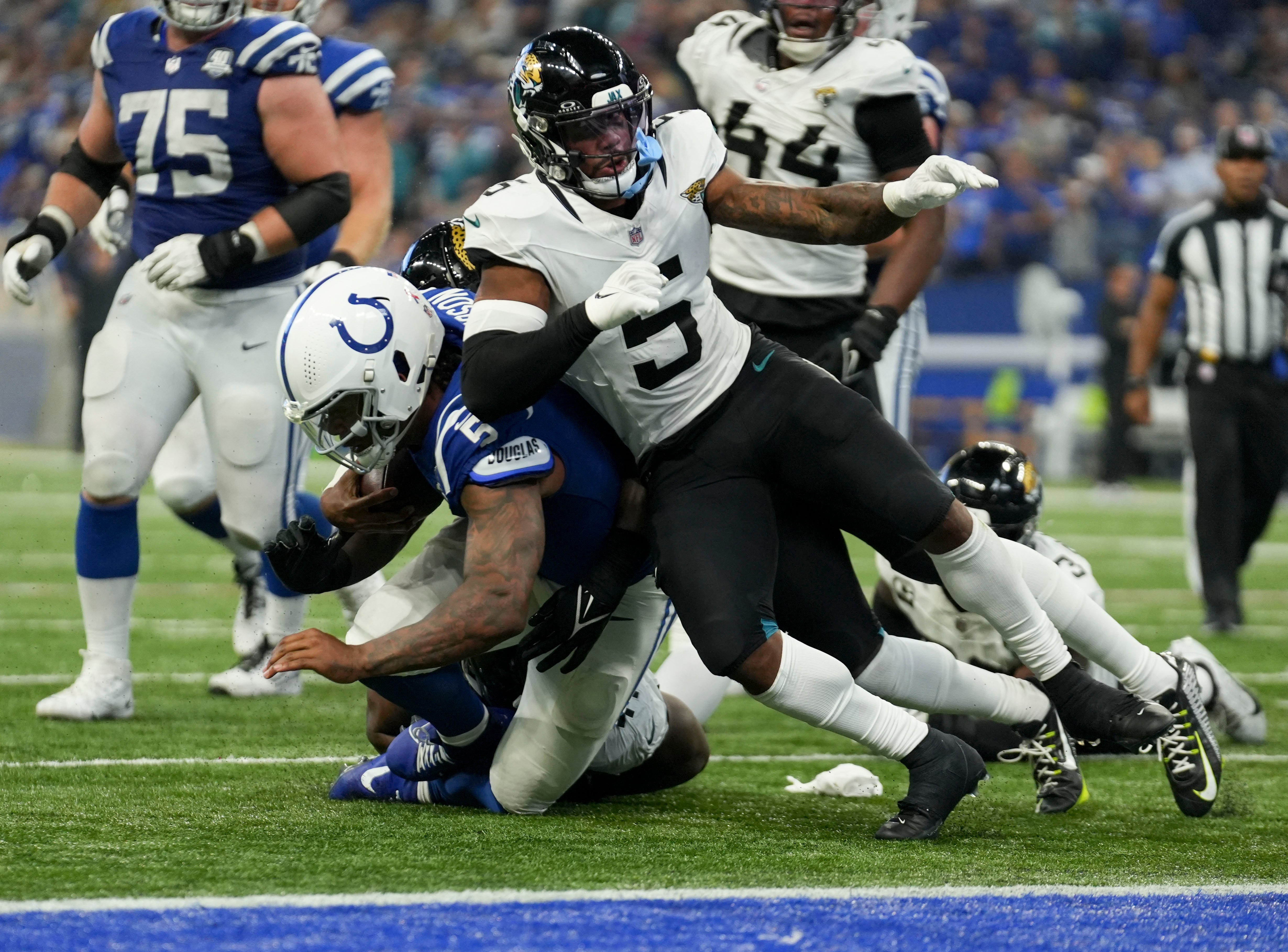 Indianapolis Colts quarterback Anthony Richardson (5) collides with Jacksonville Jaguars safety Andre Cisco (5) as he dives short of the end zone Sunday, Sept. 10, 2023, during a game against the Jacksonville Jaguars at Lucas Oil Stadium in Indianapolis.