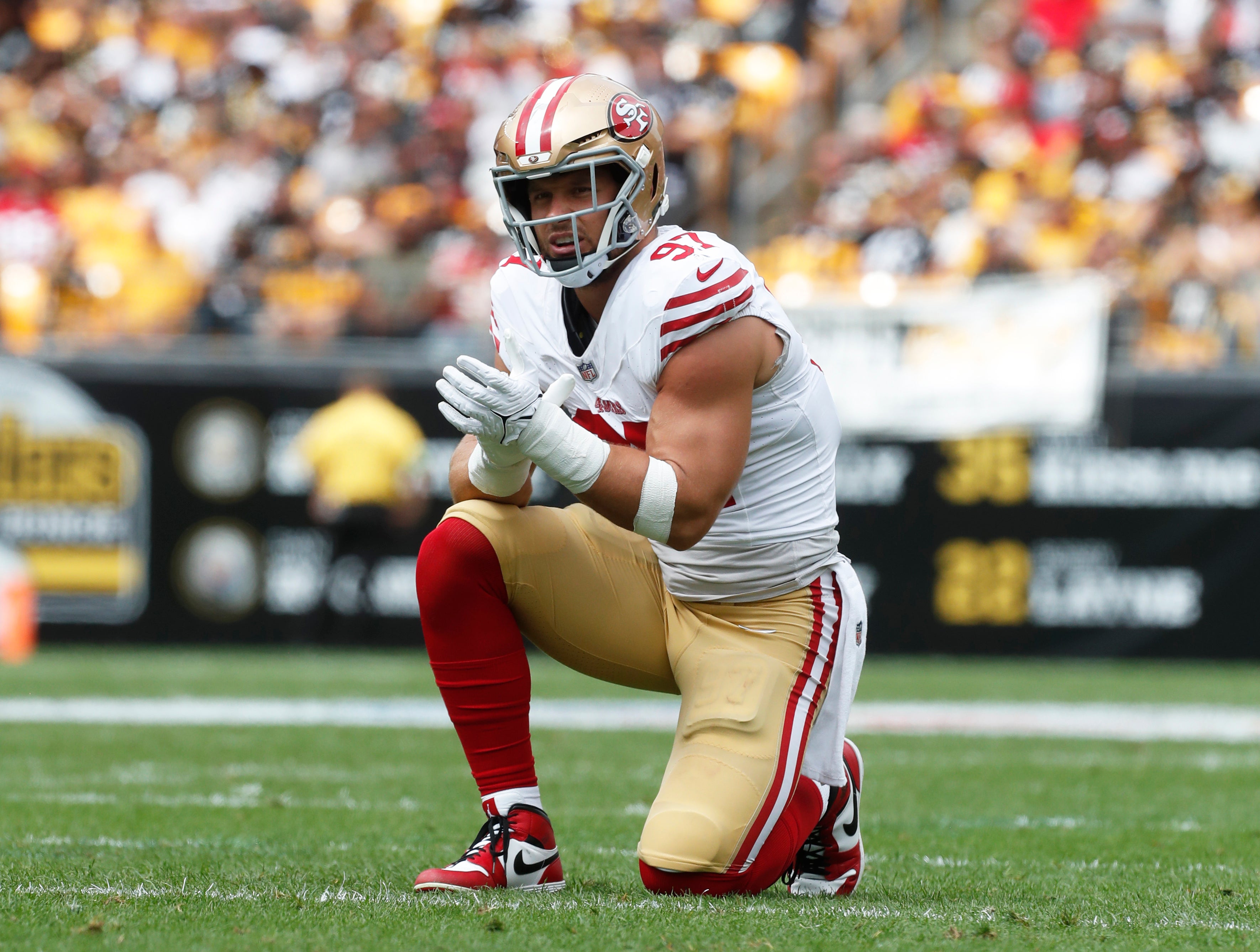 Sep 10, 2023; Pittsburgh, Pennsylvania, USA; San Francisco 49ers defensive end Nick Bosa (97) reacts at the line of scrimmage against the Pittsburgh Steelers during the second quarter at Acrisure Stadium. Mandatory Credit: Charles LeClaire-USA TODAY Sports
