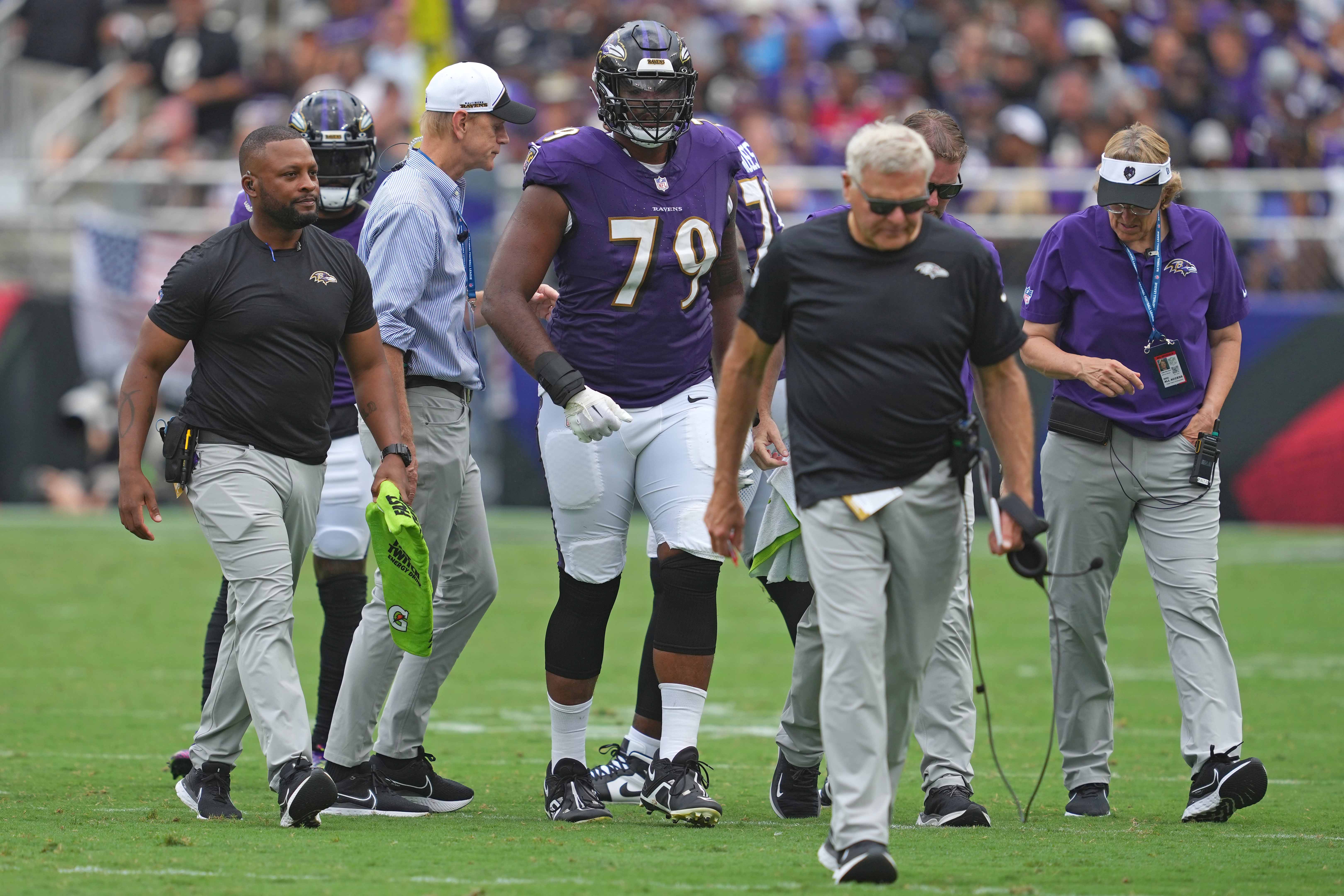 Sep 10, 2023; Baltimore, Maryland, USA; Baltimore Ravens tackle Ronnie Stanley (79) is helped from the field in the fourth quarter against the Houston Texans at M&T Bank Stadium. Mandatory Credit: Mitch Stringer-USA TODAY Sports