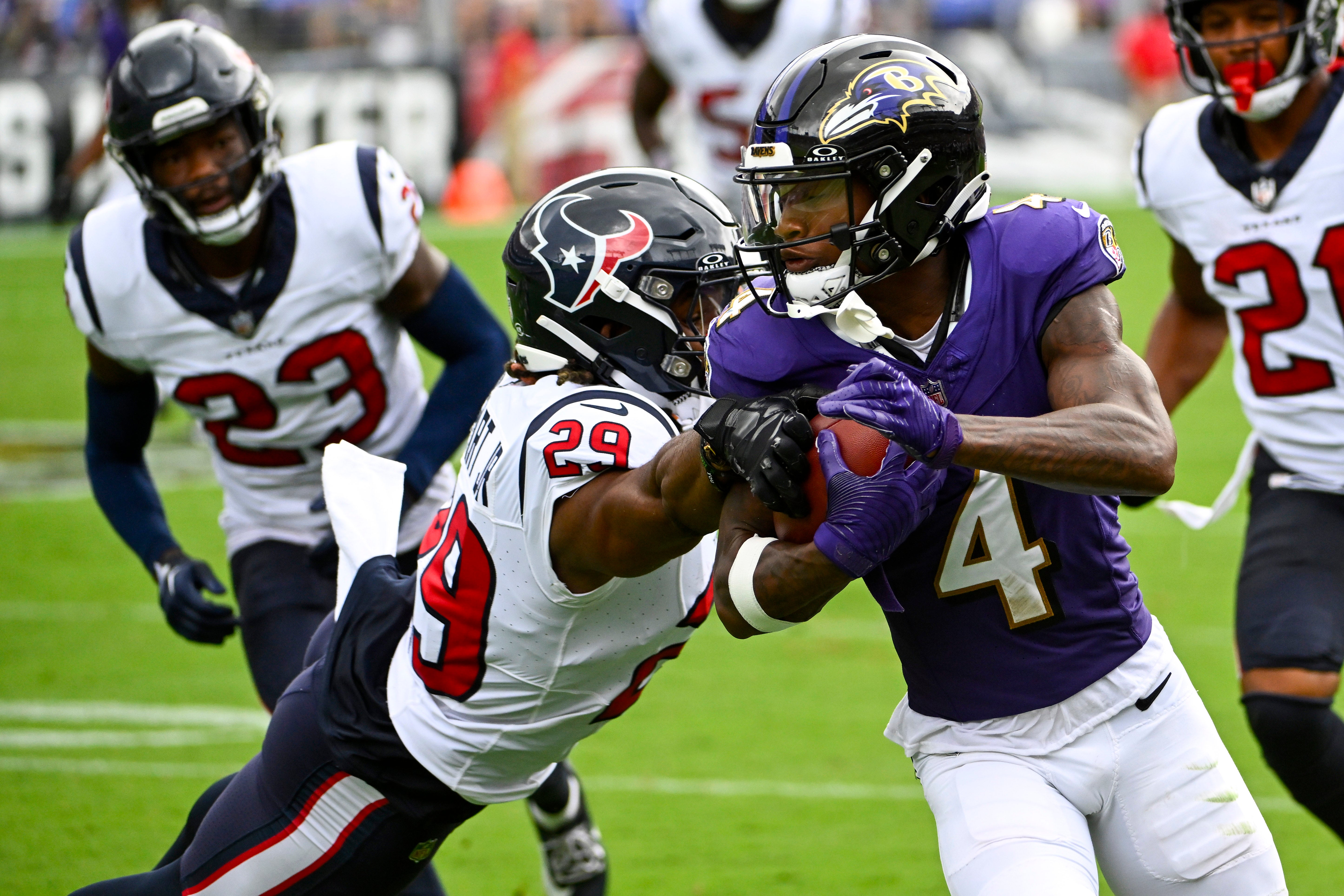 Sep 10, 2023; Baltimore, Maryland, USA; Baltimore Ravens wide receiver Zay Flowers (4) is tackled by Houston Texans safety M.J. Stewart (29) during the second half at M&T Bank Stadium. Mandatory Credit: Brad Mills-USA TODAY Sports