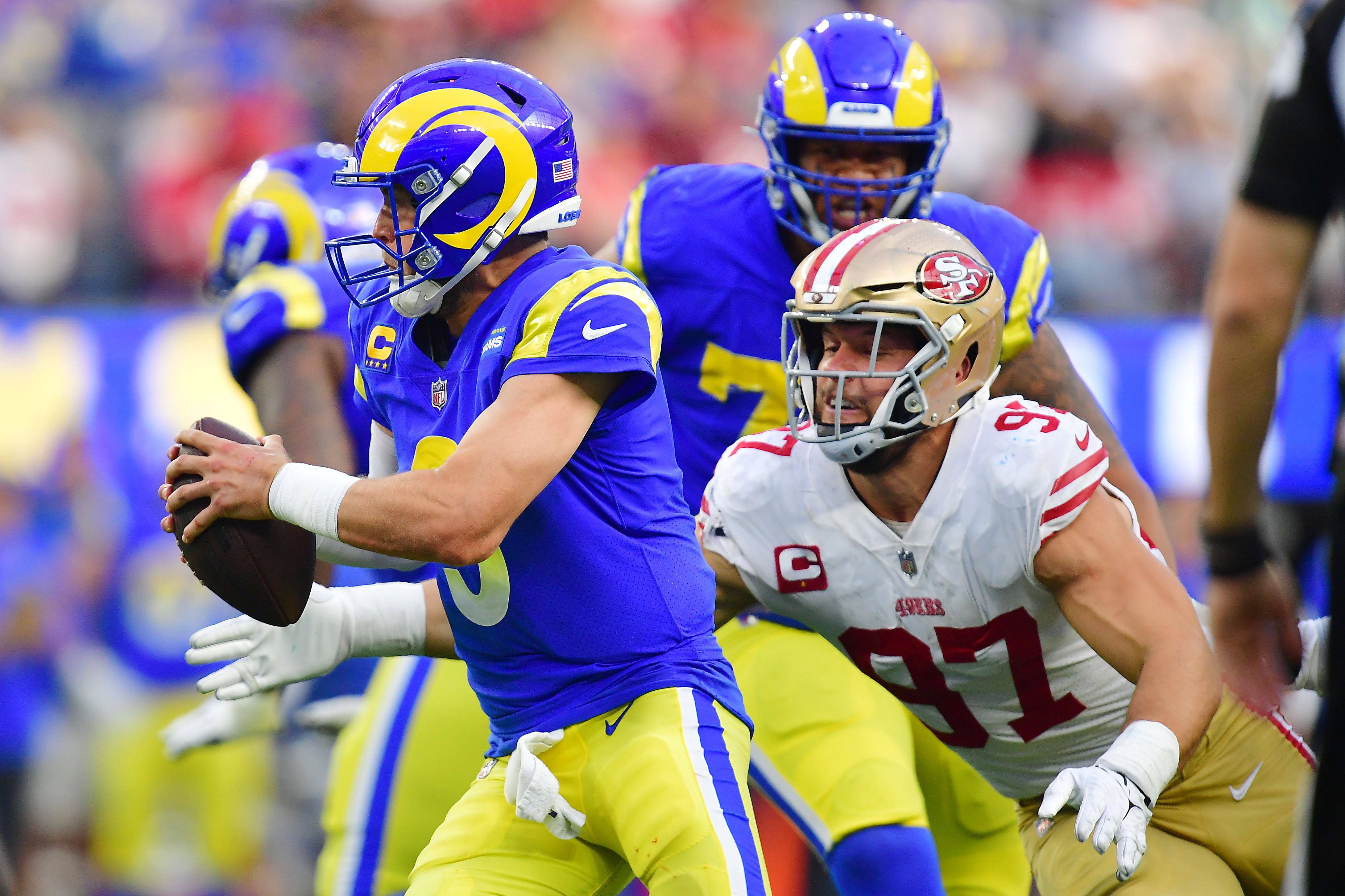 Oct 30, 2022; Inglewood, California, USA; San Francisco 49ers defensive end Nick Bosa (97) moves in against Los Angeles Rams quarterback Matthew Stafford (9) during the second half at SoFi Stadium. Mandatory Credit: Gary A. Vasquez-USA TODAY Sports