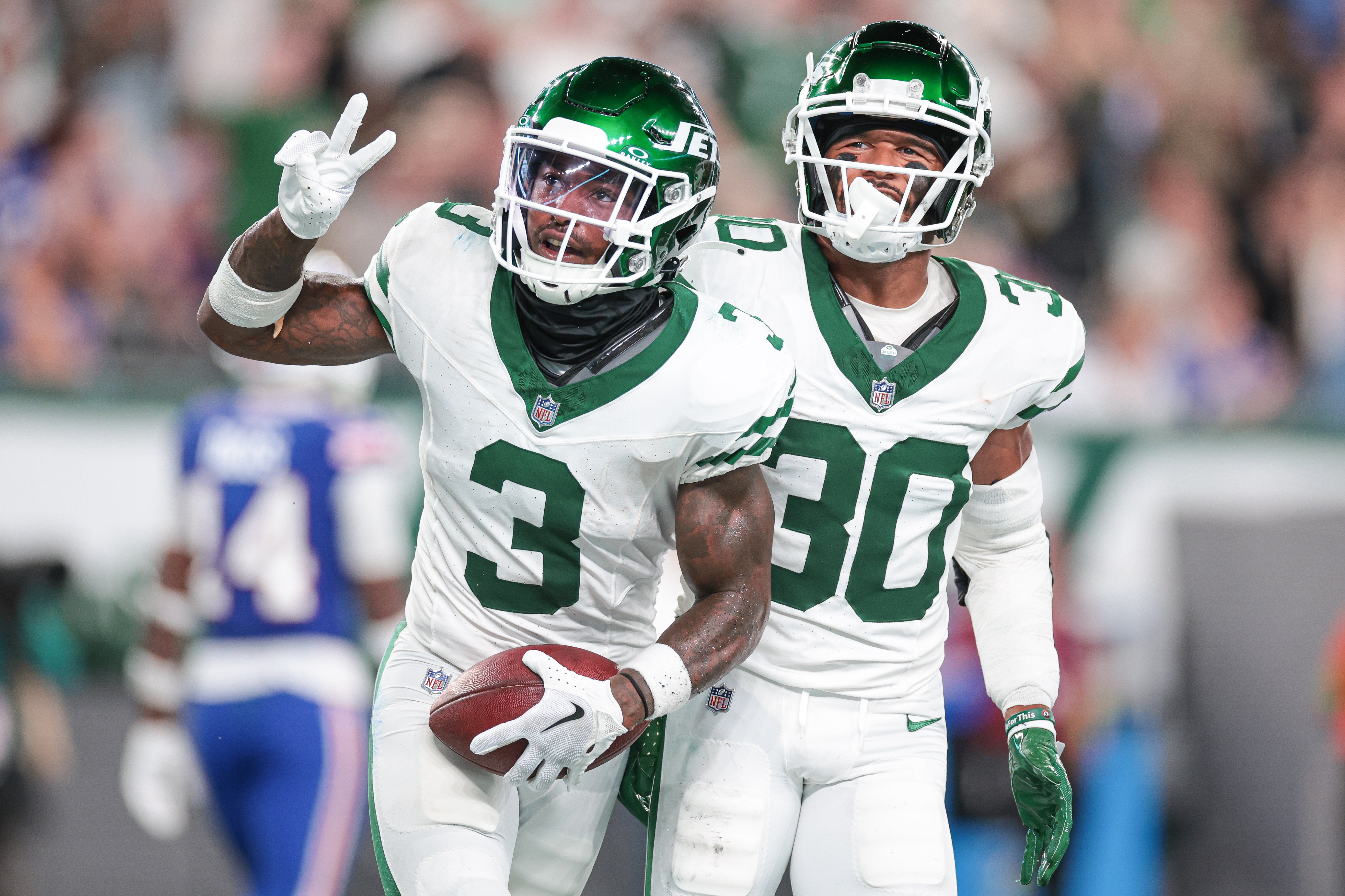 Sep 11, 2023; East Rutherford, New Jersey, USA; New York Jets safety Jordan Whitehead (3) celebrates after an interception with cornerback Michael Carter II (30) during the second half against the Buffalo Bills at MetLife Stadium. Vincent Carchietta-USA TODAY Sports