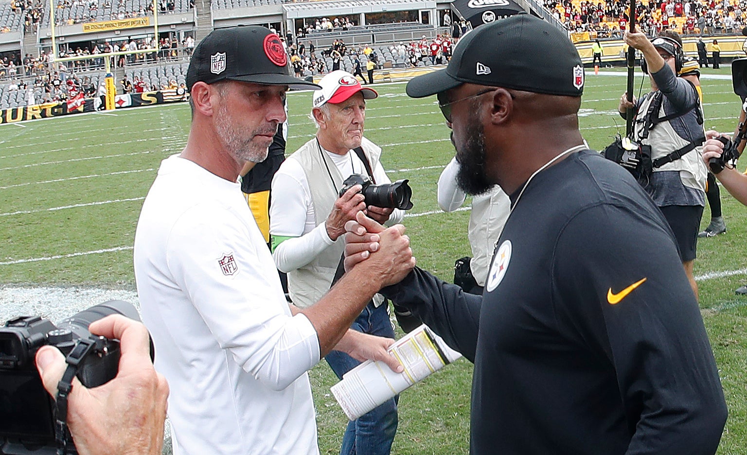 Sep 10, 2023; Pittsburgh, Pennsylvania, USA; San Francisco 49ers head coach Kyle Shanahan (left) and Pittsburgh Steelers head coach Mike Tomlin (right) shake hands after their game at Acrisure Stadium. San Francisco won 30-7. Mandatory Credit: Charles LeClaire-USA TODAY Sports