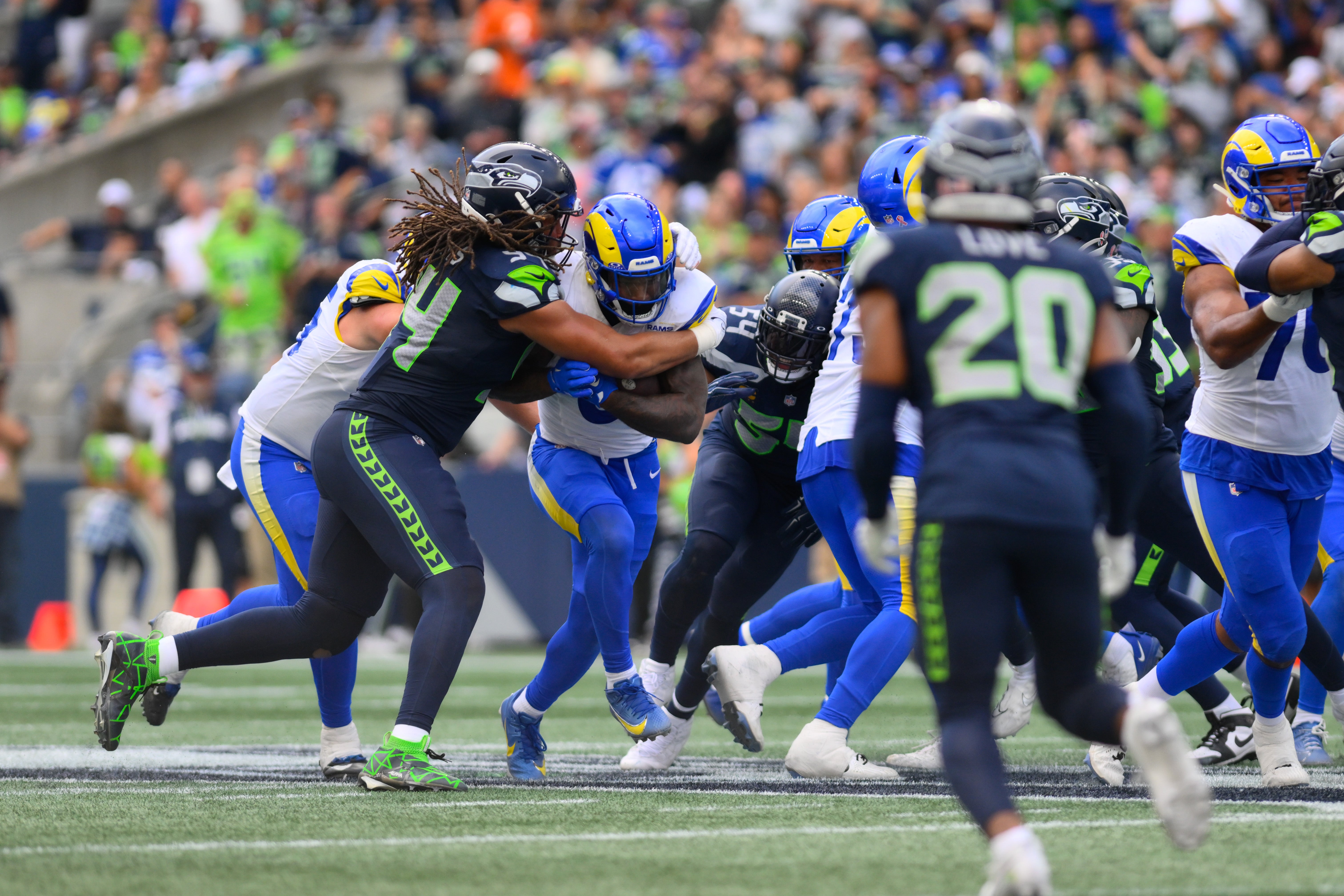Sep 10, 2023; Seattle, Washington, USA; Los Angeles Rams running back Cam Akers (3) carries the ball while Seattle Seahawks defensive end Mike Morris (94) tries to tackle during the second half at Lumen Field. Mandatory Credit: Steven Bisig-USA TODAY Sports