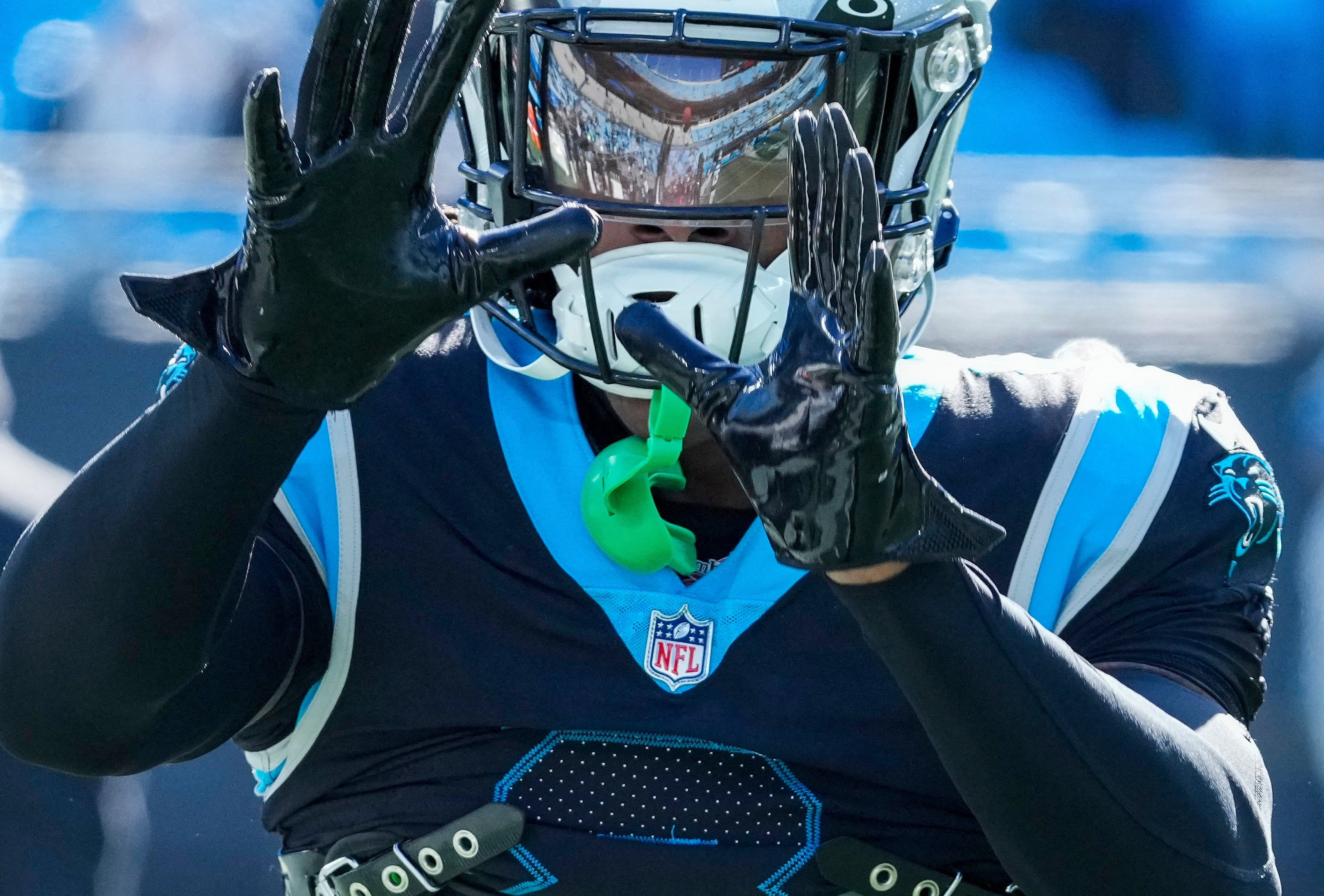 Dec 24, 2022; Charlotte, North Carolina, USA; Carolina Panthers cornerback Jaycee Horn (8) makes a catch during pregame warm ups against the Detroit Lions at Bank of America Stadium. Mandatory Credit: Jim Dedmon-USA TODAY Sports