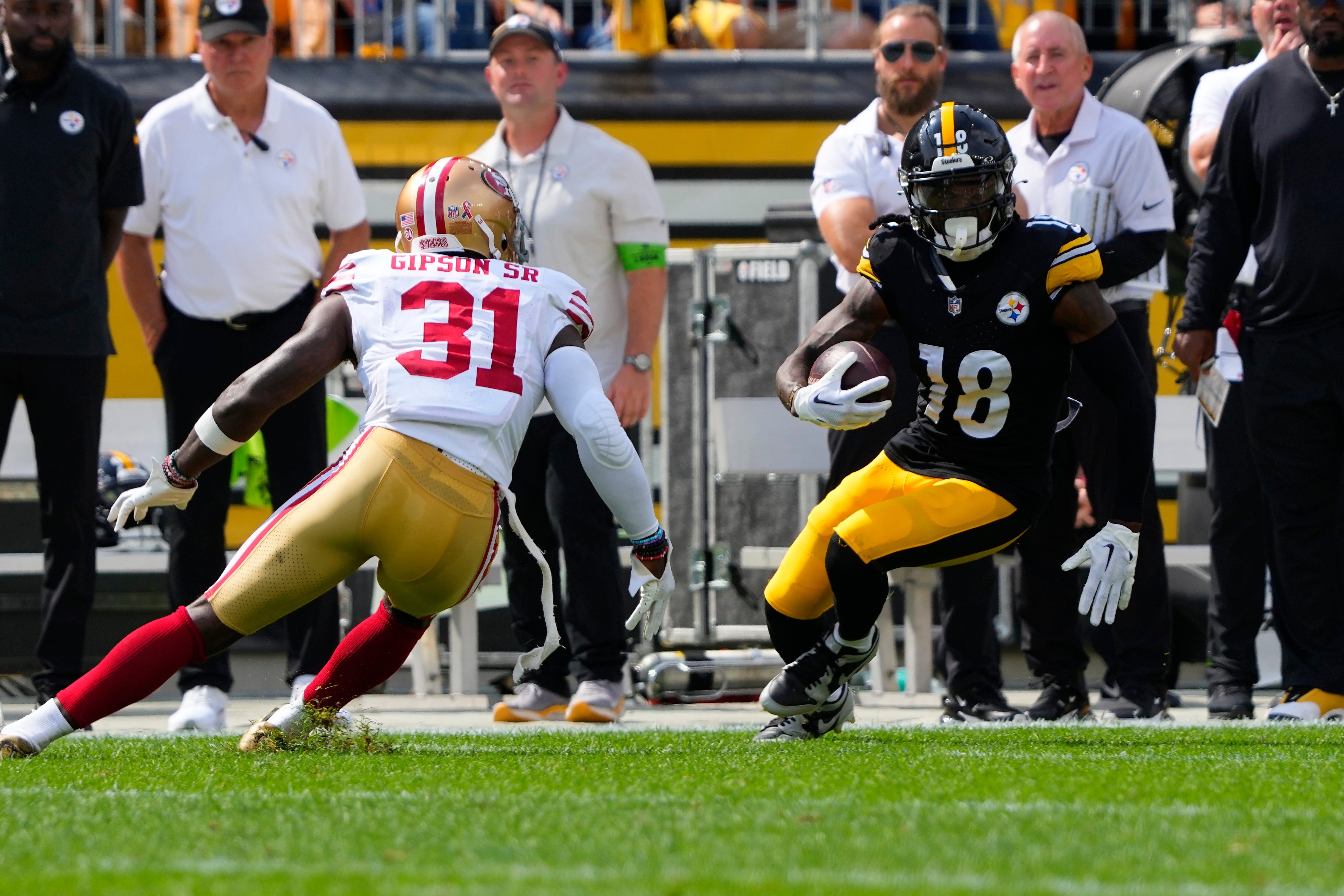Sep 10, 2023; Pittsburgh, Pennsylvania, USA; Pittsburgh Steelers wide receiver Diontae Johnson (18) runs with the ball after making a catch with San Francisco 49ers safety Tashaun Gipson Sr. (31) defending during the second half at Acrisure Stadium. Mandatory Credit: Gregory Fisher-USA TODAY Sports  