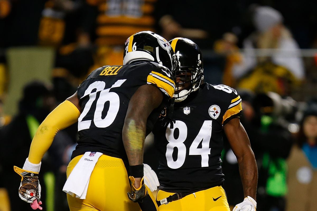 Dec 10, 2017; Pittsburgh, PA, USA; Pittsburgh Steelers running back Le'Veon Bell (26) celebrates with wide receiver Antonio Brown (84) after scoring a touchdown against the Baltimore Ravens during the first quarter at Heinz Field. Mandatory Credit: Charles LeClaire-USA TODAY Sports  