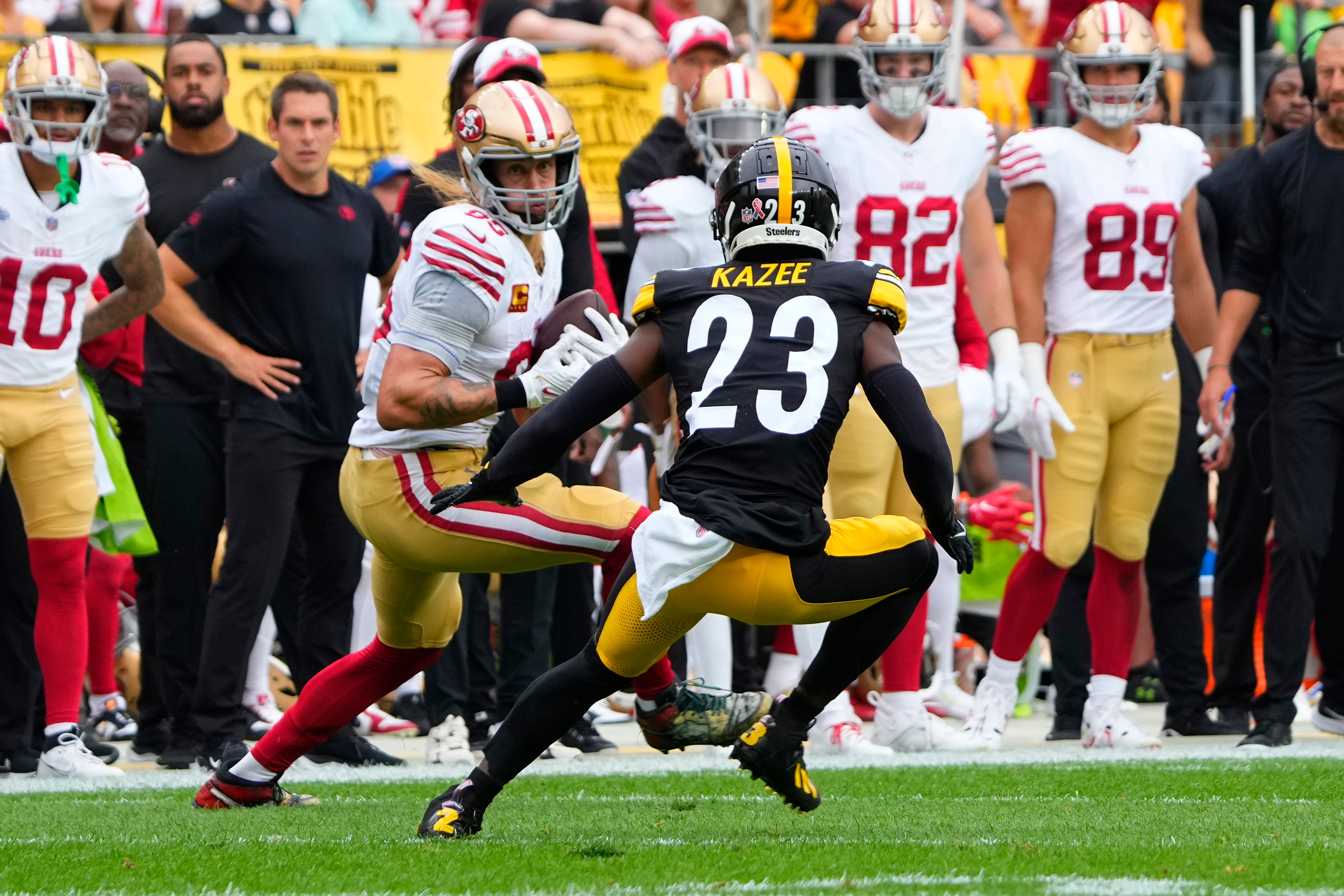 Sep 10, 2023; Pittsburgh, Pennsylvania, USA; San Francisco 49ers tight end George Kittle (85) makes a catch with Pittsburgh Steelers safety Damontae Kazee (23) defending during the first half at Acrisure Stadium. Mandatory Credit: Gregory Fisher-USA TODAY Sports