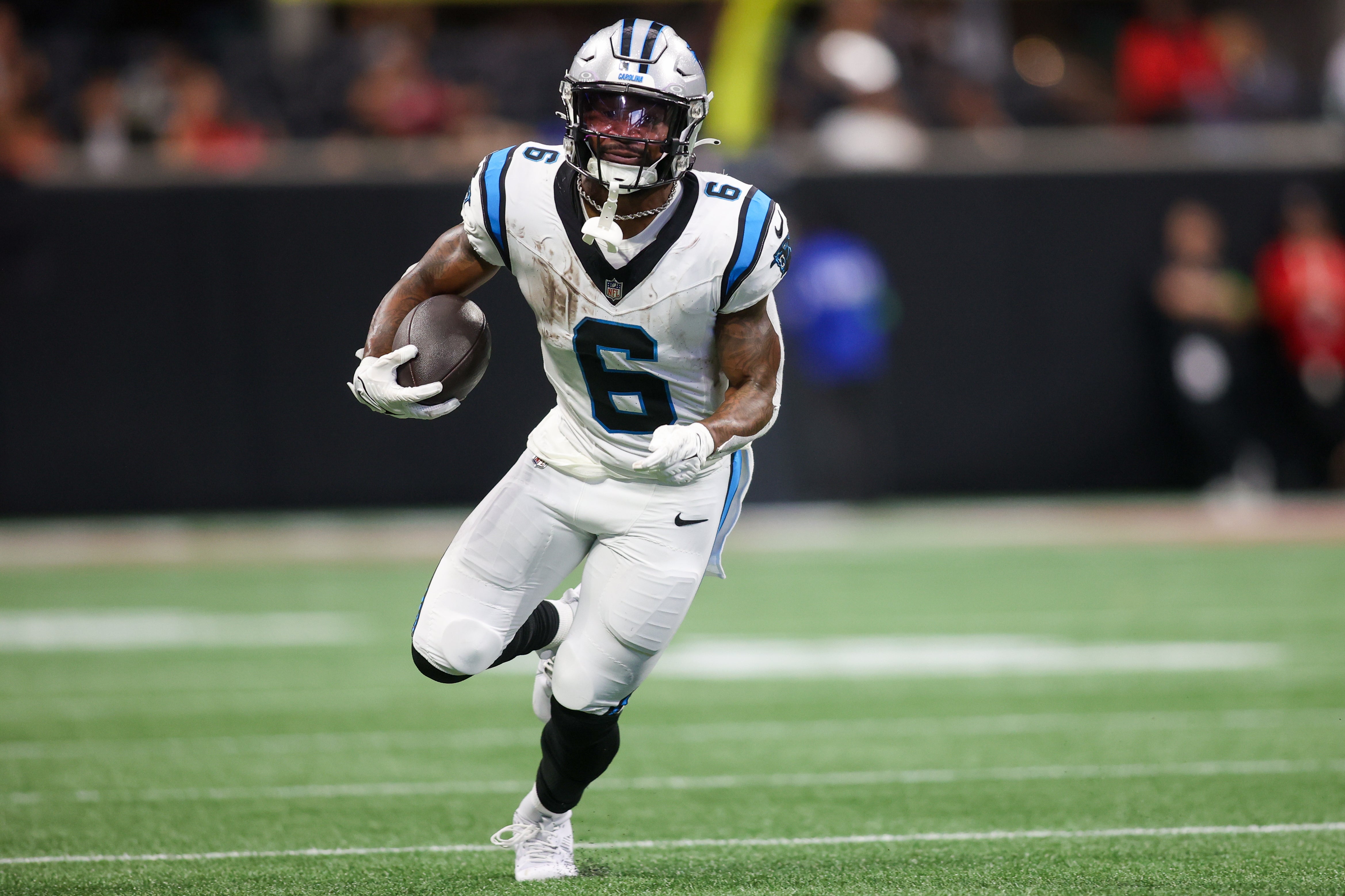 Sep 10, 2023; Atlanta, Georgia, USA; Carolina Panthers running back Miles Sanders (6) runs the ball against the Atlanta Falcons in the second quarter at Mercedes-Benz Stadium. Mandatory Credit: Brett Davis-USA TODAY Sports