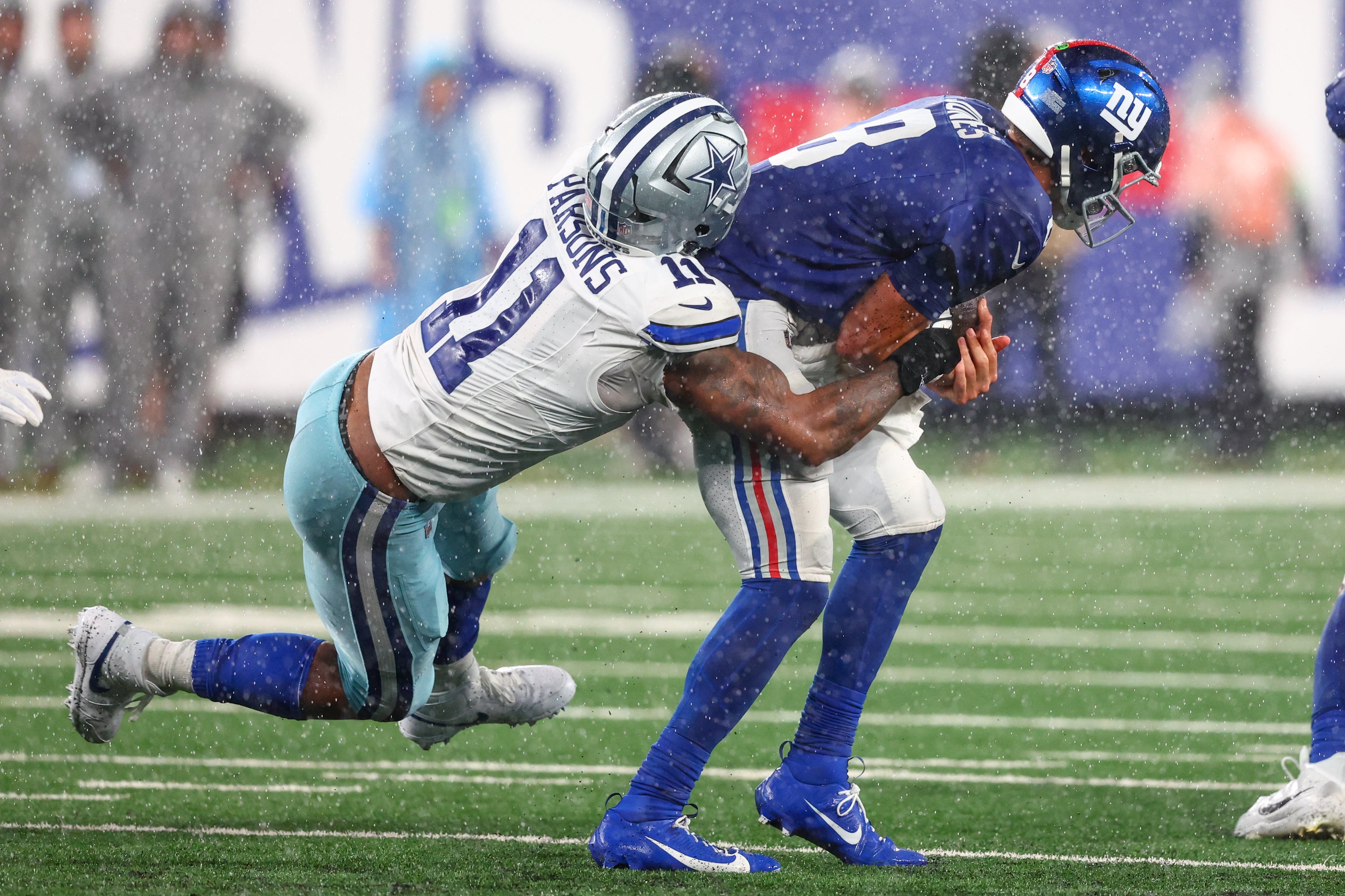 New York Giants quarterback Daniel Jones (8) is sacked by Dallas Cowboys linebacker Micah Parsons (11) during the second half at MetLife Stadium. Mandatory Credit: Ed Mulholland-USA TODAY Sports