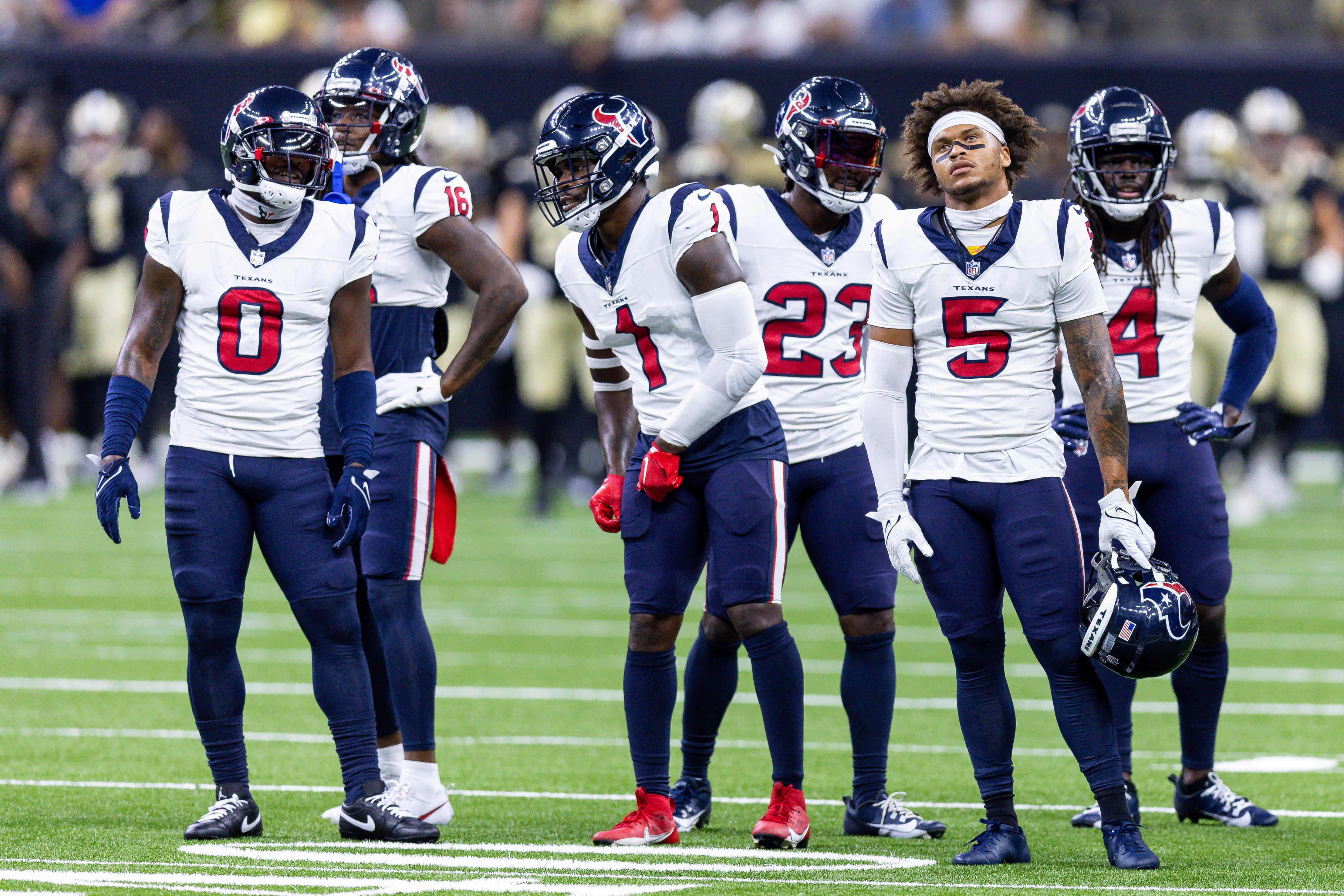 Aug 27, 2023; New Orleans, Louisiana, USA; Houston Texans cornerback Desmond King II (0) and safety Jimmie Ward (1) and safety Jalen Pitre (5) look on during pregame against the New Orleans Saints at the Caesars Superdome.