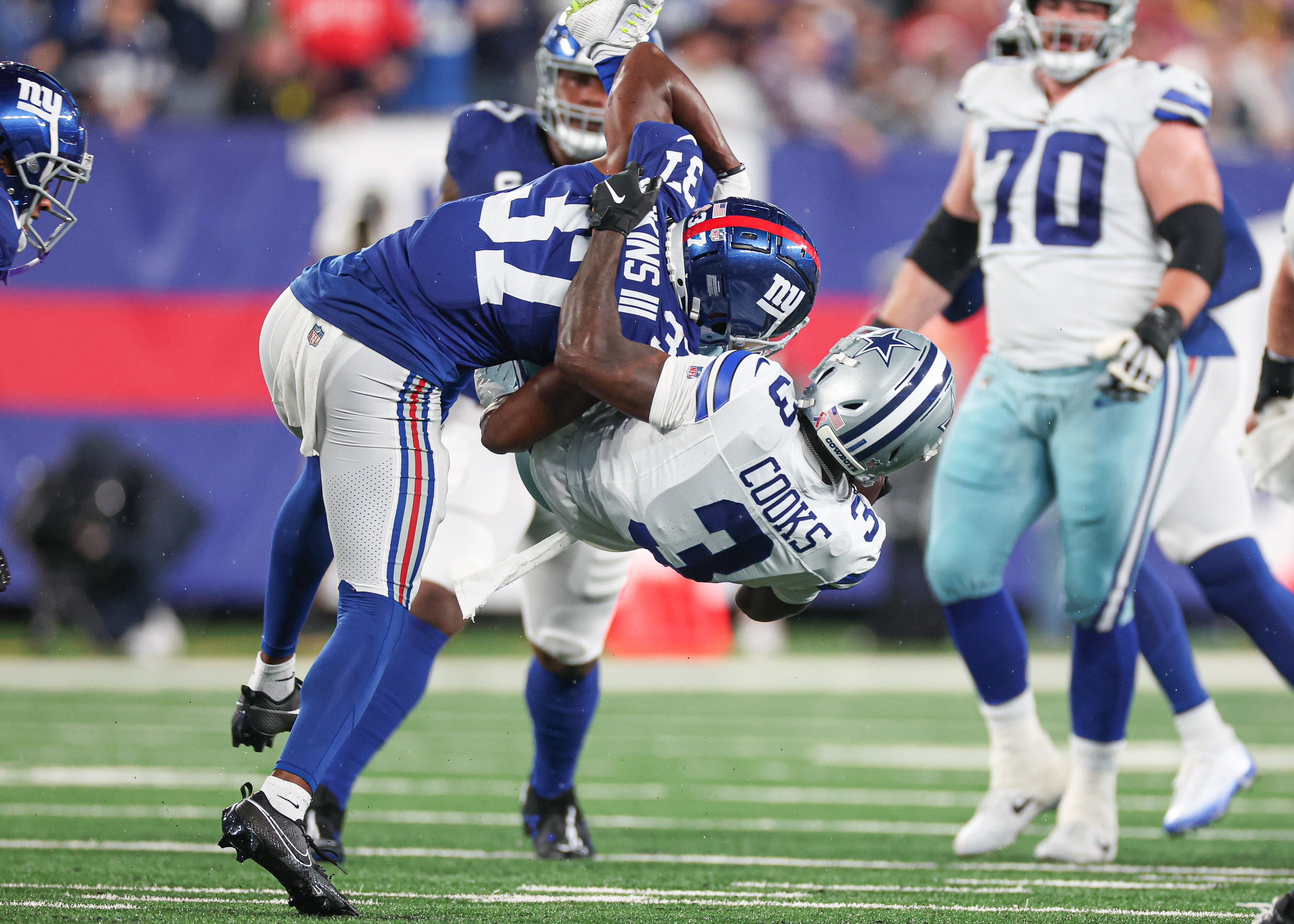 Dallas Cowboys wide receiver Brandin Cooks (3) is tackled by New York Giants cornerback Tre Hawkins III (37) during the first half at MetLife Stadium. Mandatory Credit: Vincent Carchietta-USA TODAY Sports