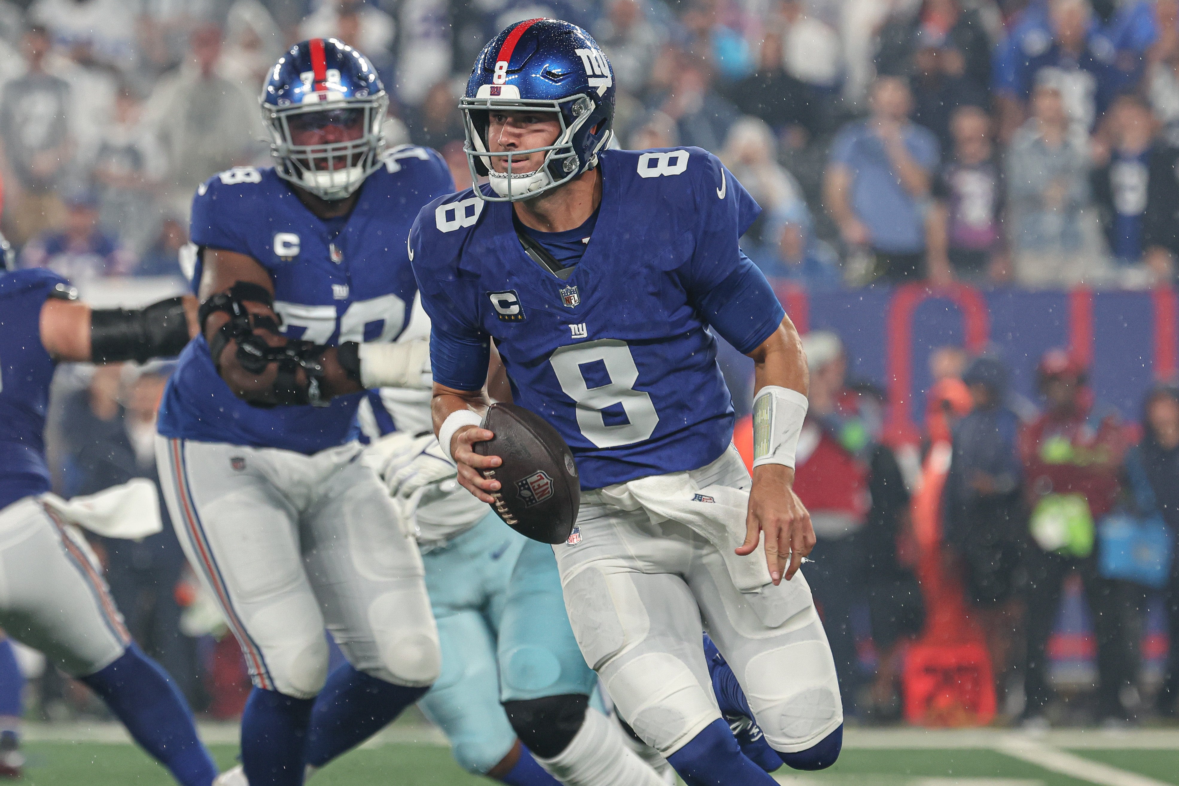 Sep 10, 2023; East Rutherford, New Jersey, USA; New York Giants quarterback Daniel Jones (8) scrambles during the first quarter against the Dallas Cowboys at MetLife Stadium. Mandatory Credit: Vincent Carchietta-USA TODAY Sports