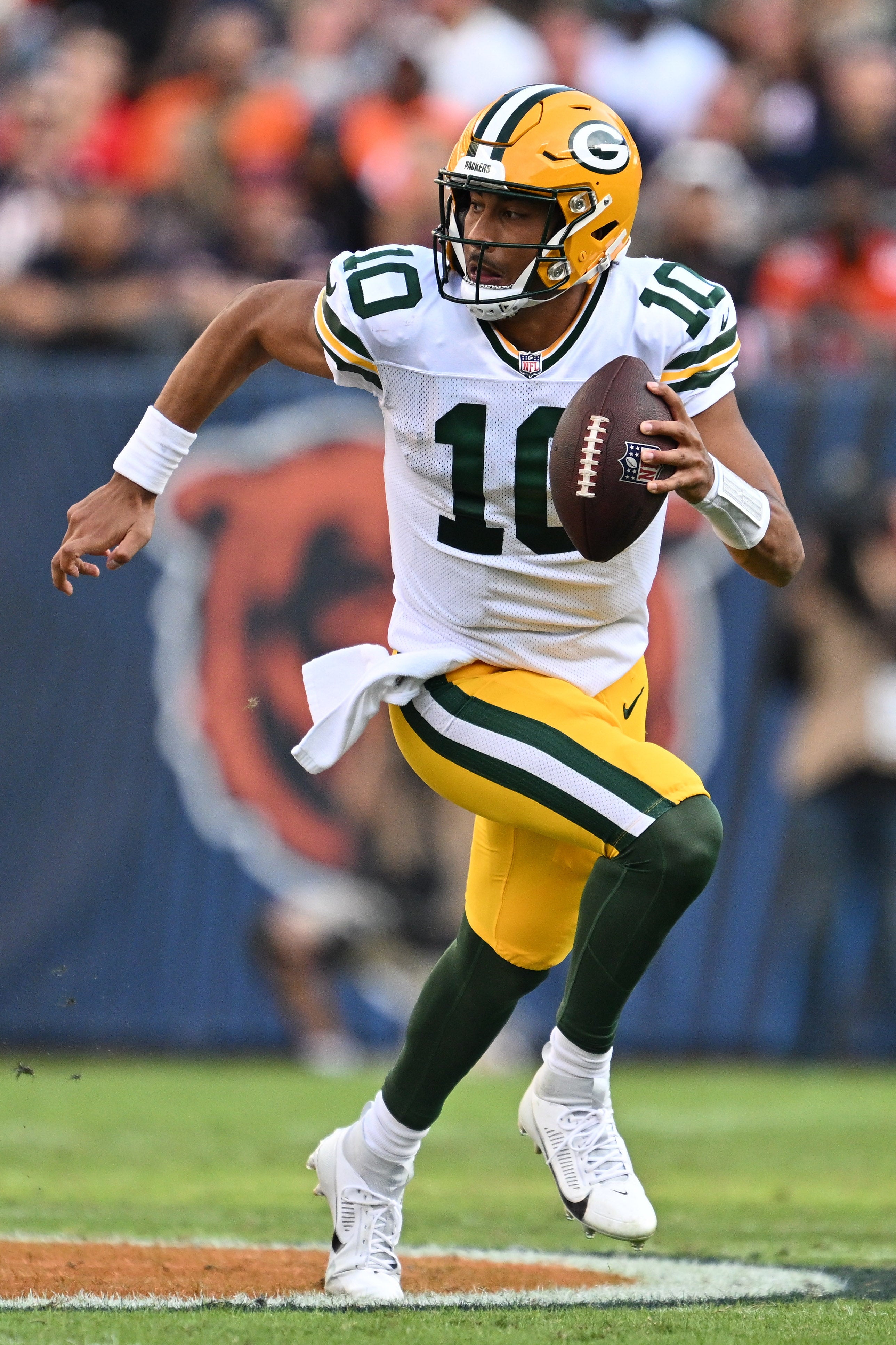 Sep 10, 2023; Chicago, Illinois, USA; Green Bay Packers quarterback Jordan Love (10) runs with the ball against the Chicago Bears at Soldier Field. Mandatory Credit: Jamie Sabau-USA TODAY Sports