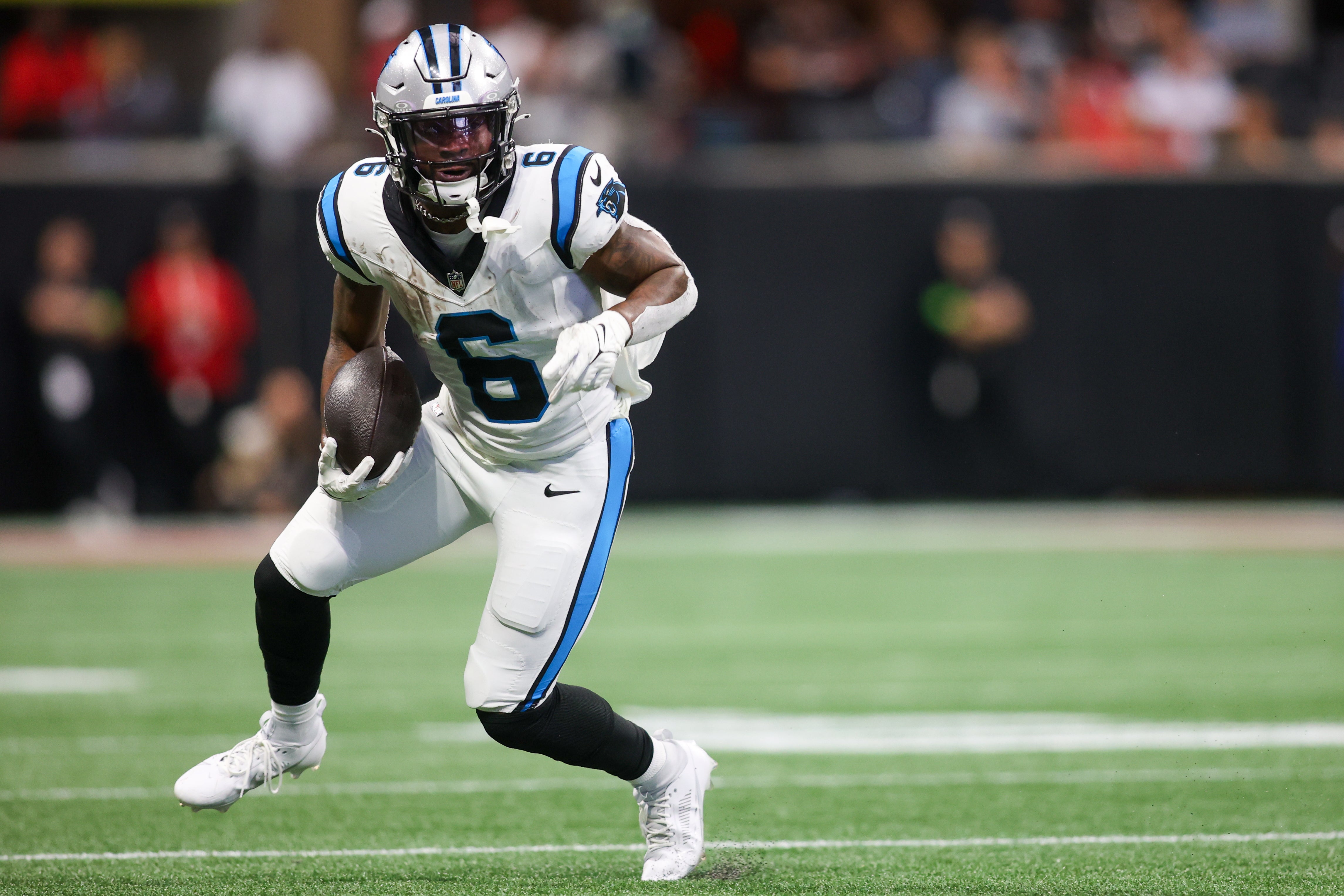 Sep 10, 2023; Atlanta, Georgia, USA; Carolina Panthers running back Miles Sanders (6) runs the ball against the Atlanta Falcons in the second quarter at Mercedes-Benz Stadium. Mandatory Credit: Brett Davis-USA TODAY Sports