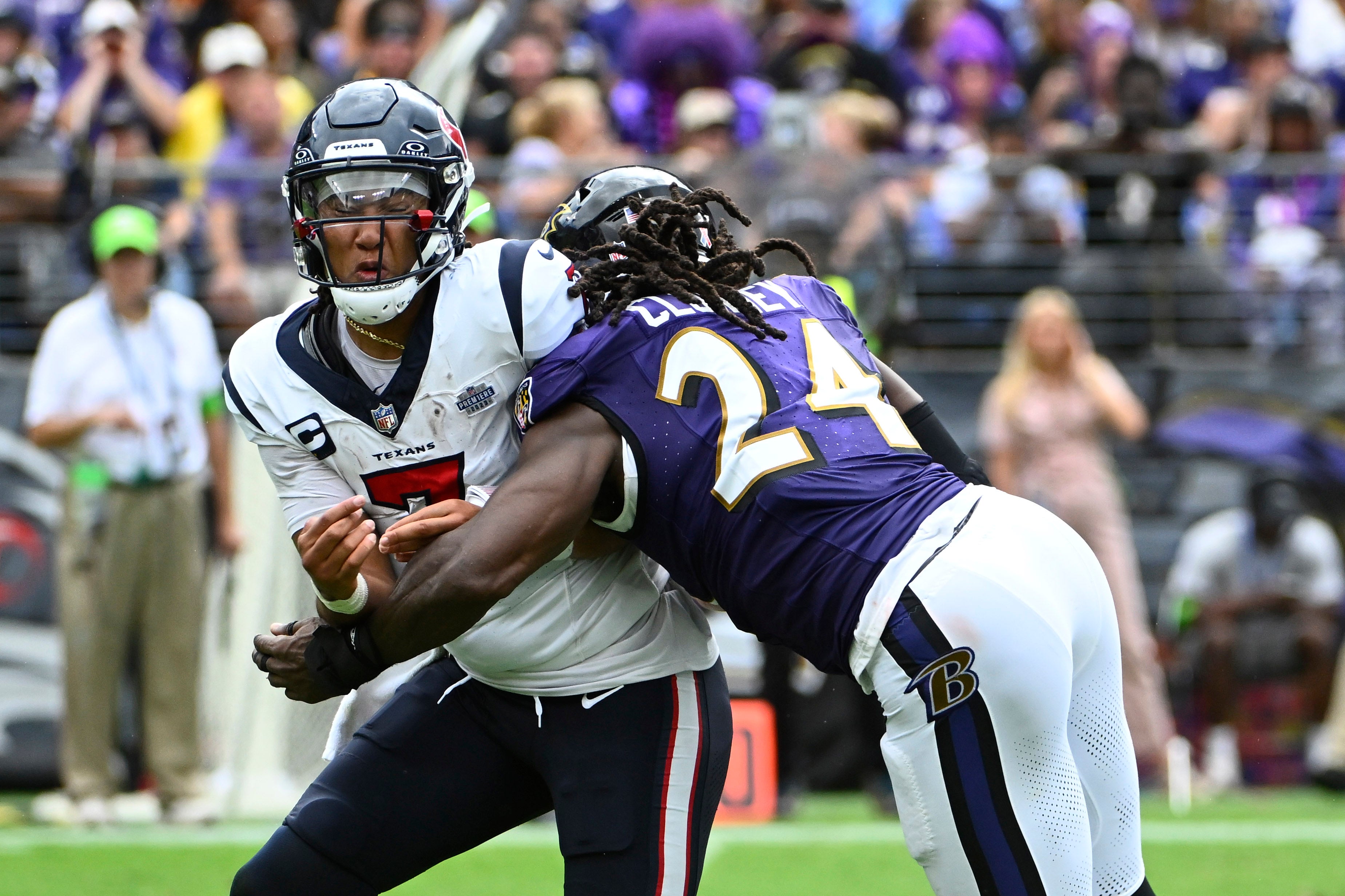Sep 10, 2023; Baltimore, Maryland, USA; Houston Texans quarterback C.J. Stroud (7) is pressured by Baltimore Ravens linebacker Jadeveon Clowney (24) during the second half at M&T Bank Stadium.
