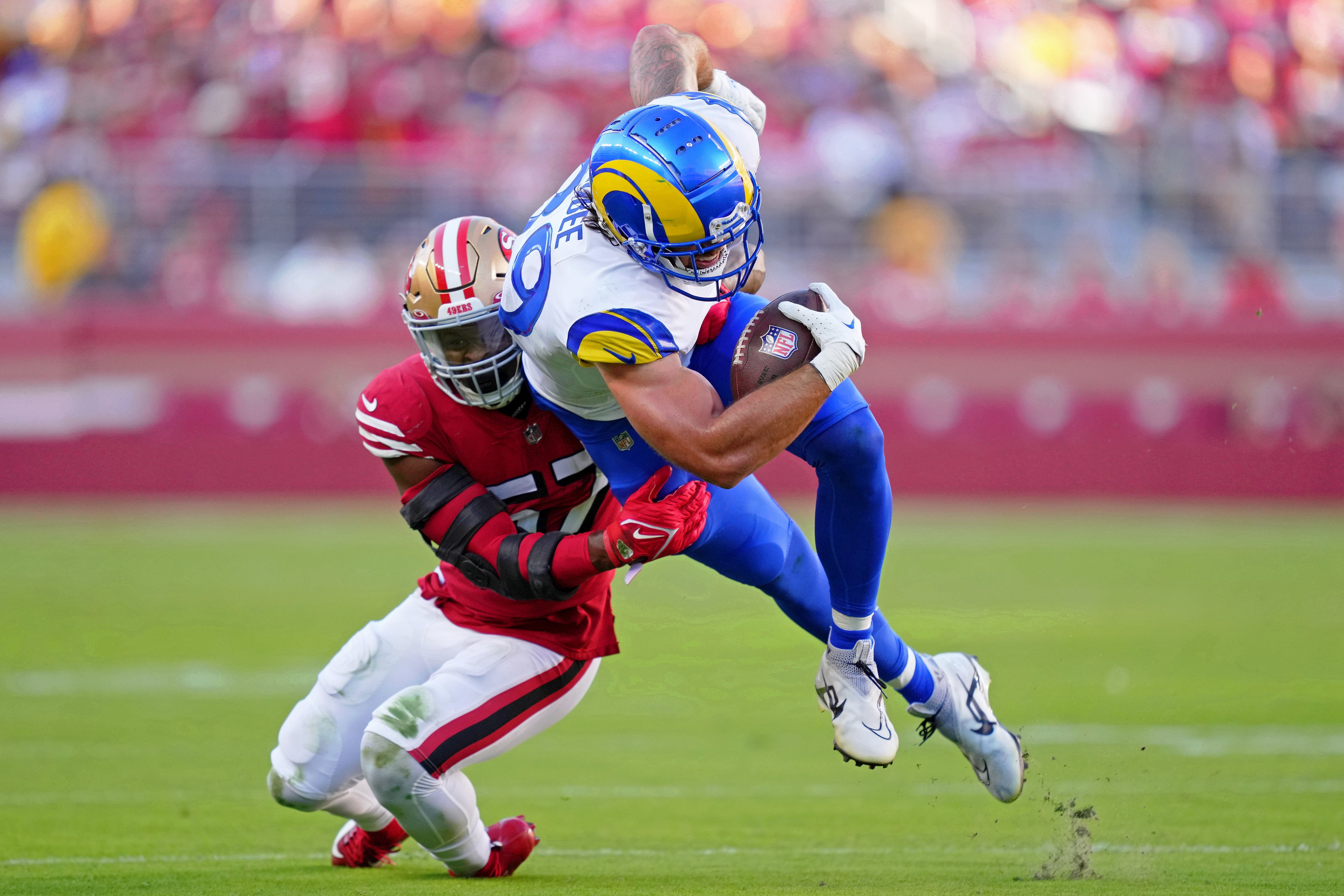 Oct 3, 2022; Santa Clara, California, USA; Los Angeles Rams tight end Tyler Higbee (89) is tackled by San Francisco 49ers linebacker Dre Greenlaw (57) during the first quarter during the first quarter at Levi's Stadium. Mandatory Credit: Kyle Terada-USA TODAY Sports