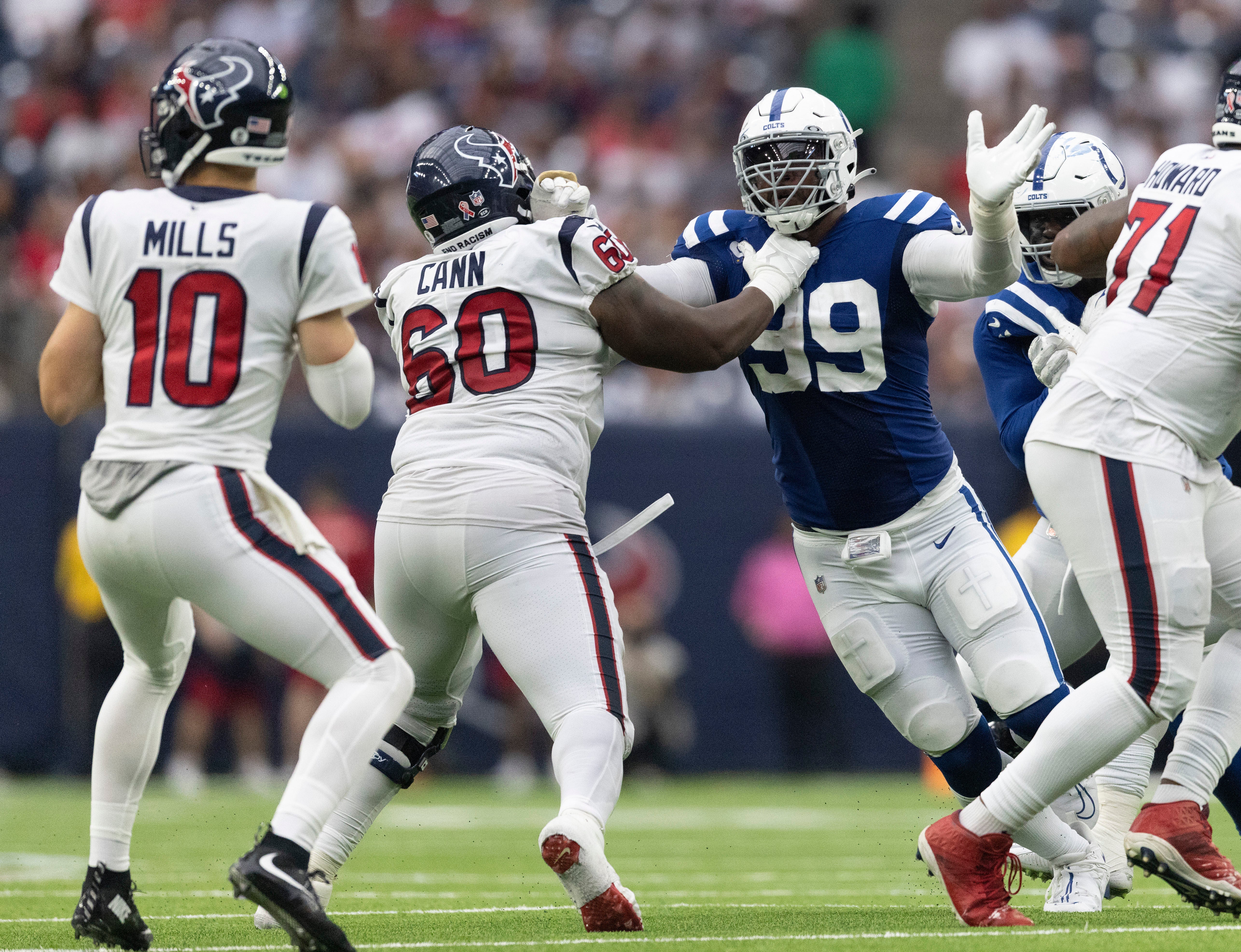 Sep 11, 2022; Houston, Texas, USA; Indianapolis Colts defensive tackle DeForest Buckner (99) rushes against Houston Texans guard A.J. Cann (60) in the fourth quarter at NRG Stadium.