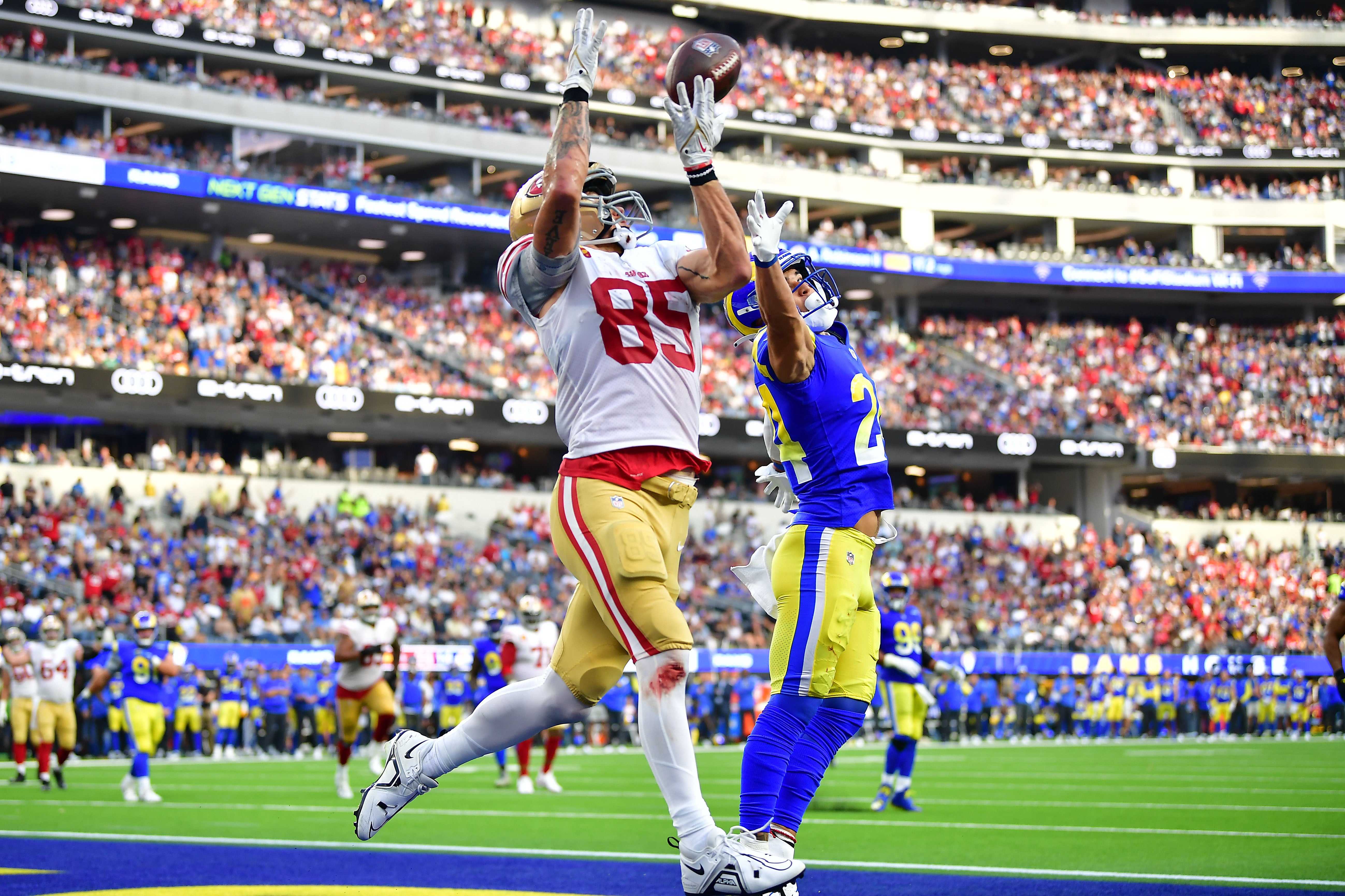 Oct 30, 2022; Inglewood, California, USA; San Francisco 49ers tight end George Kittle (85) catches a touchdown pass against Los Angeles Rams safety Taylor Rapp (24) during the second half at SoFi Stadium. Mandatory Credit: Gary A. Vasquez-USA TODAY Sports