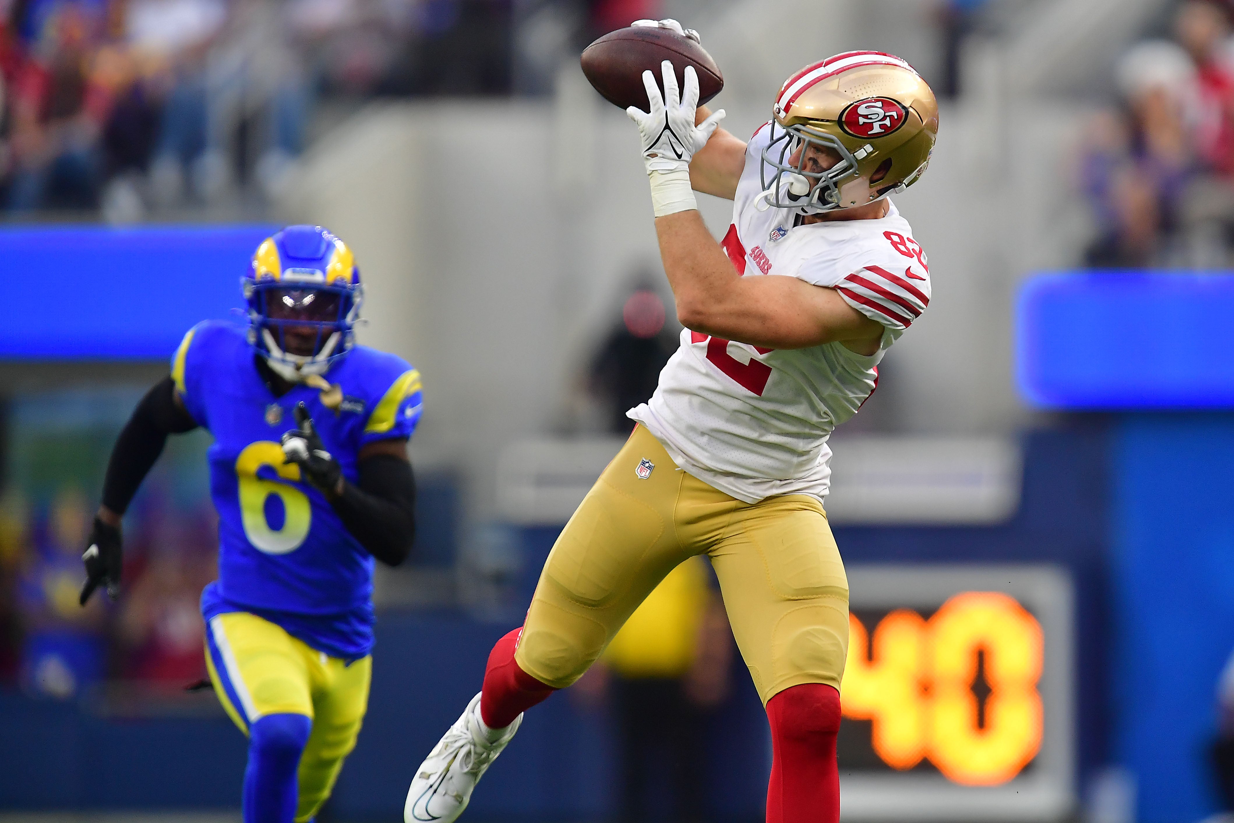Oct 30, 2022; Inglewood, California, USA; San Francisco 49ers tight end Ross Dwelley (82) catches a pass against the Los Angeles Rams during the second half at SoFi Stadium. Mandatory Credit: Gary A. Vasquez-USA TODAY Sports