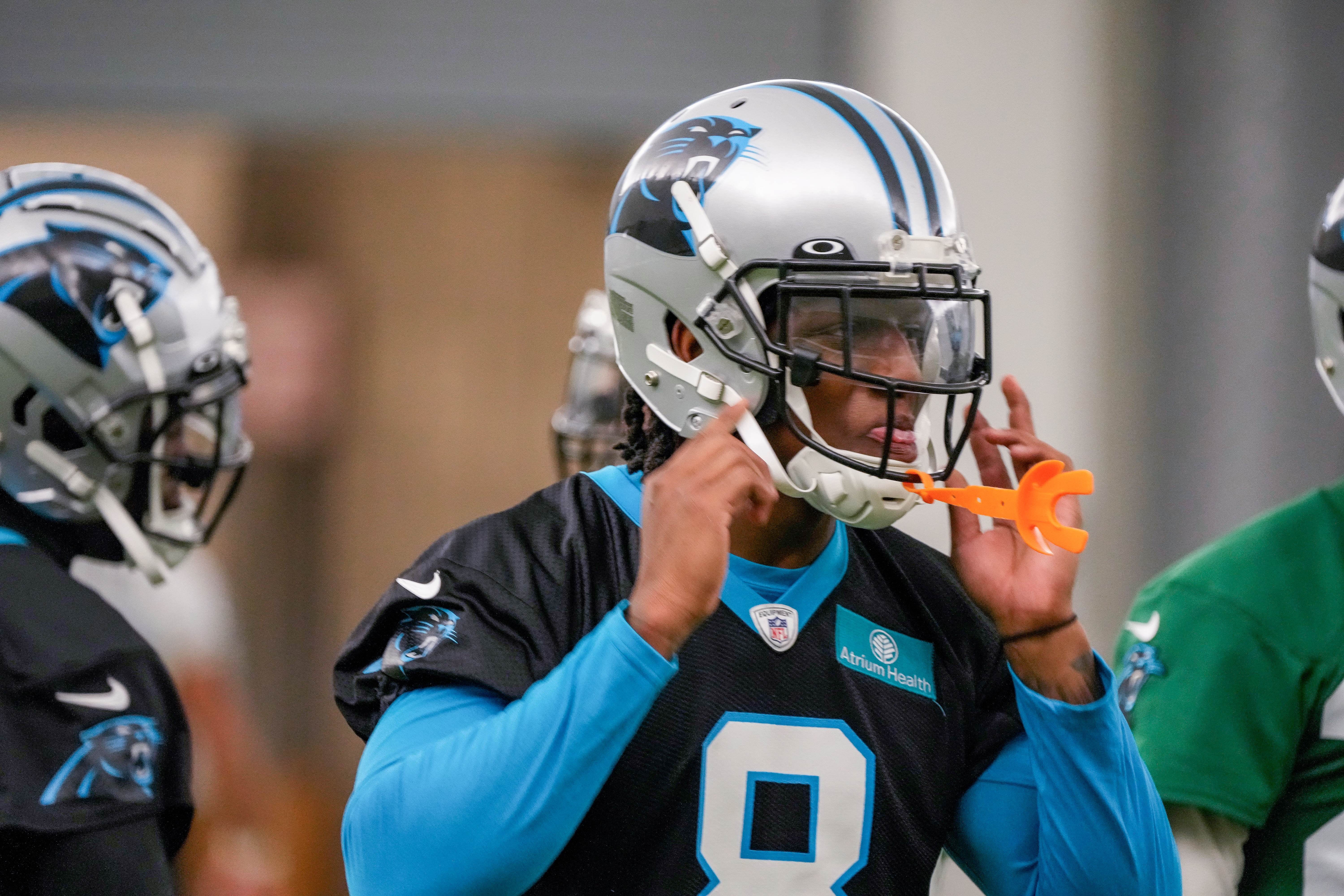 Jun 8, 2022; Charlotte, North Carolina, USA; Carolina Panthers defensive back Jaycee Horn (8) dons his helmet during Carolina Panthers minicamp at Bank of America Stadium Practice Facility. Mandatory Credit: Jim Dedmon-USA TODAY Sports