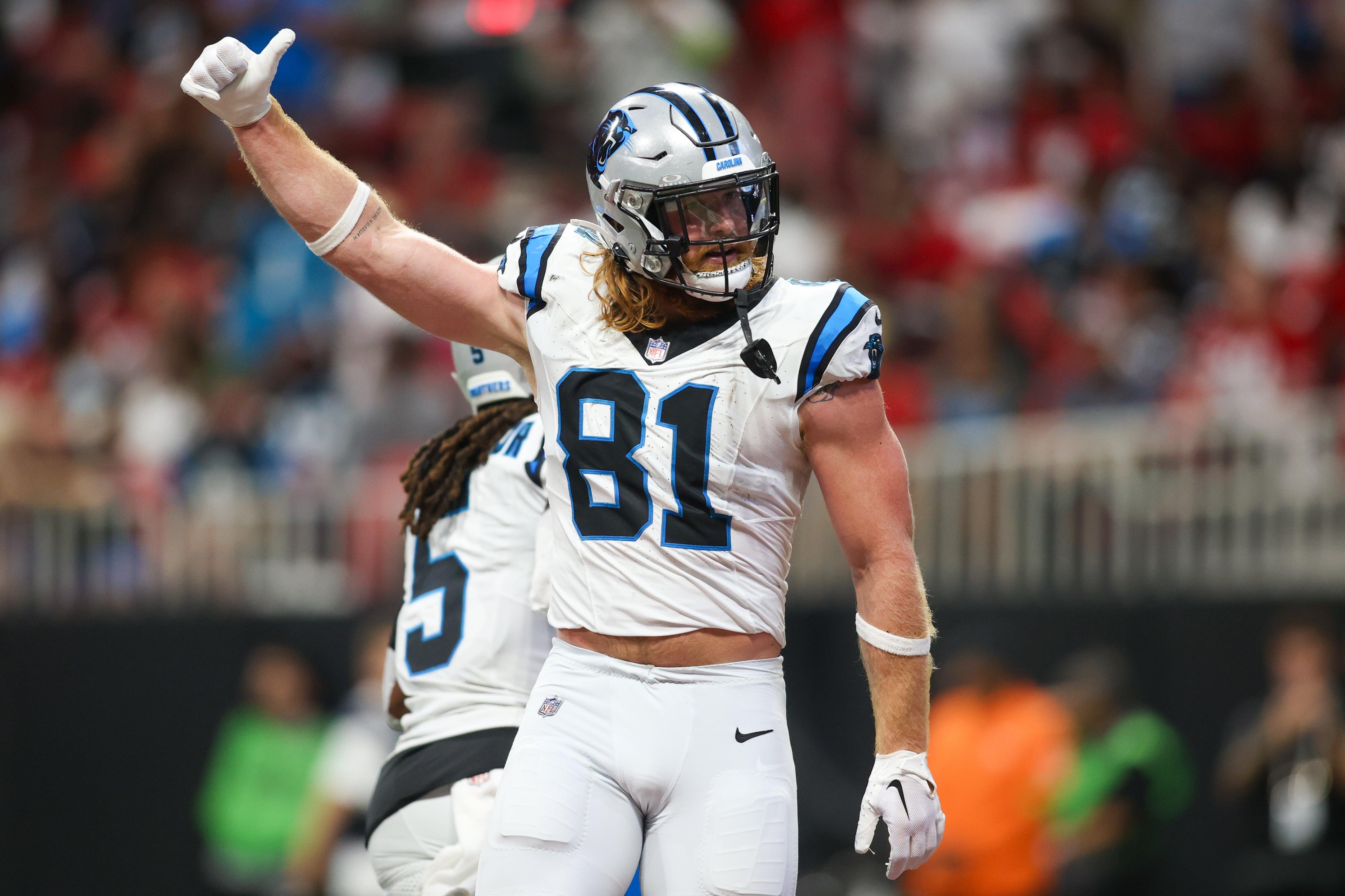 Sep 10, 2023; Atlanta, Georgia, USA; Carolina Panthers tight end Hayden Hurst (81) celebrates after a touchdown against the Atlanta Falcons in the second quarter at Mercedes-Benz Stadium. Mandatory Credit: Brett Davis-USA TODAY Sports.