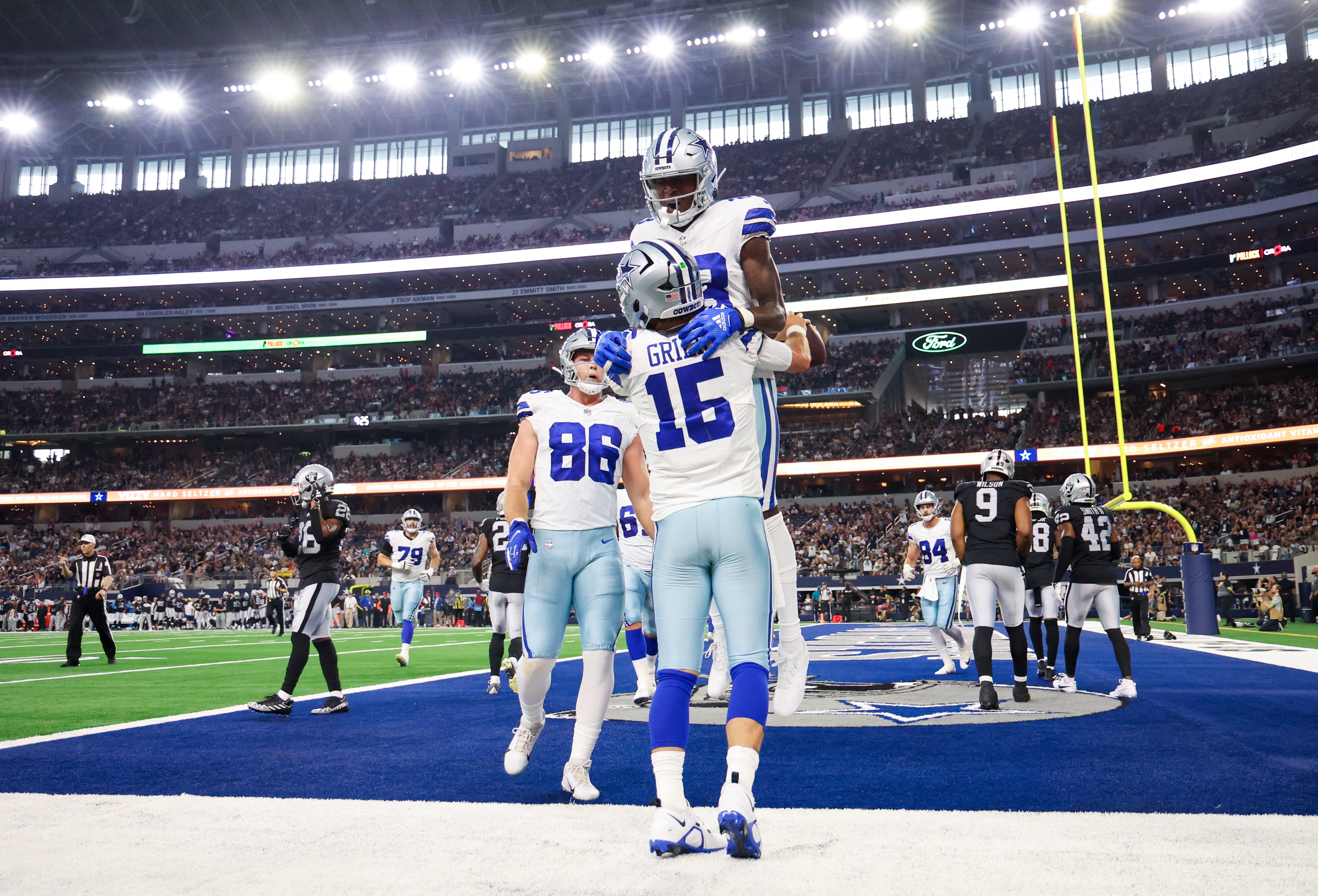 Dallas Cowboys quarterback Will Grier (15) celebrates with Dallas Cowboys wide receiver Jalen Brooks (83) after scoring a touchdown during the first quarter at AT&T Stadium. Mandatory Credit: Kevin Jairaj-USA TODAY Sports