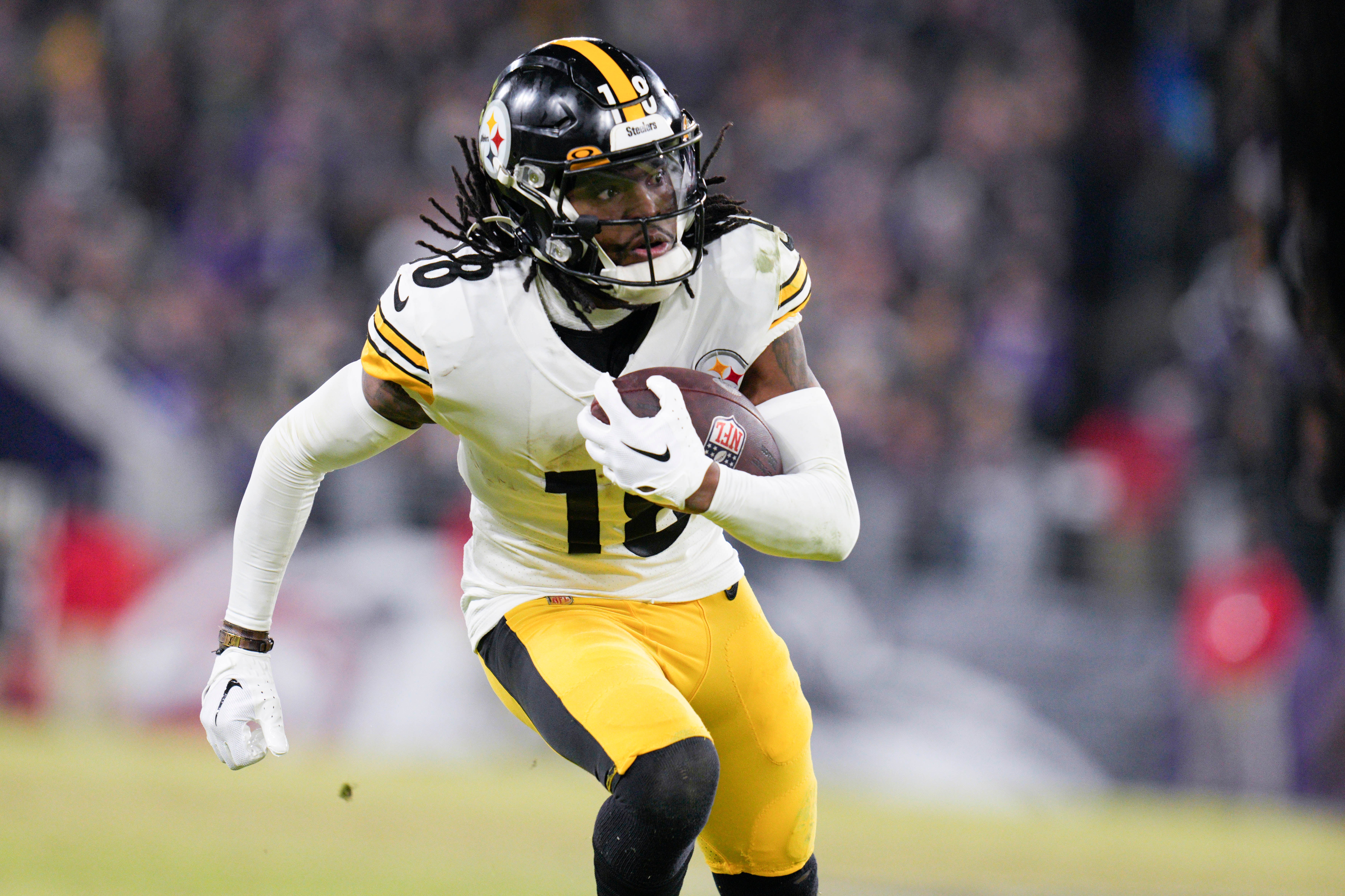 Jan 1, 2023; Baltimore, Maryland, USA; Pittsburgh Steelers wide receiver Diontae Johnson (18) runs with the ball against the Baltimore Ravens during the second half at M&T Bank Stadium. Mandatory Credit: Jessica Rapfogel-USA TODAY Sports