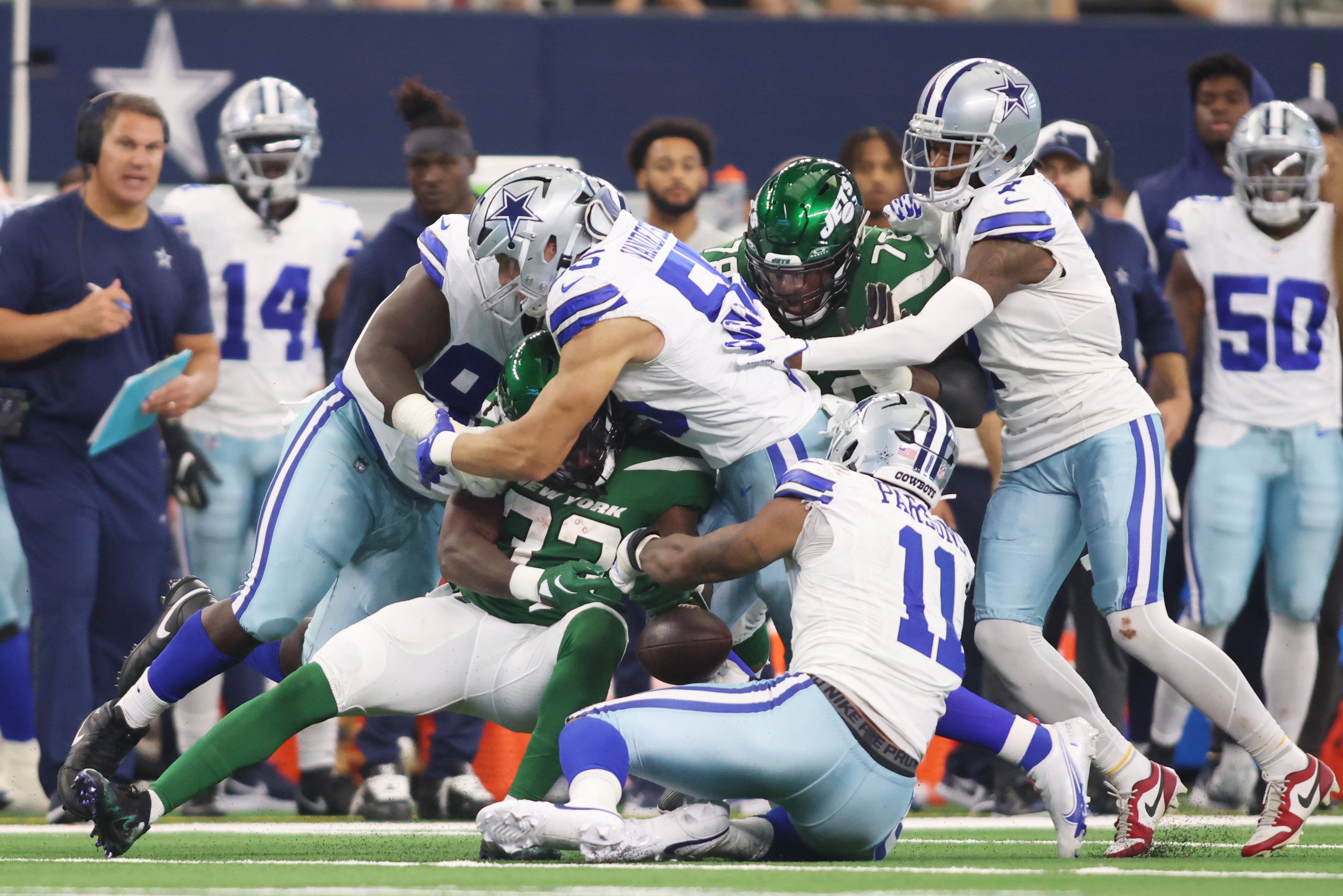 Dallas Cowboys linebacker Micah Parsons (11) causes New York Jets running back Dalvin Cook (33) to fumble the ball in the third quarter at AT&T Stadium. Mandatory Credit: Tim Heitman-USA TODAY Sports