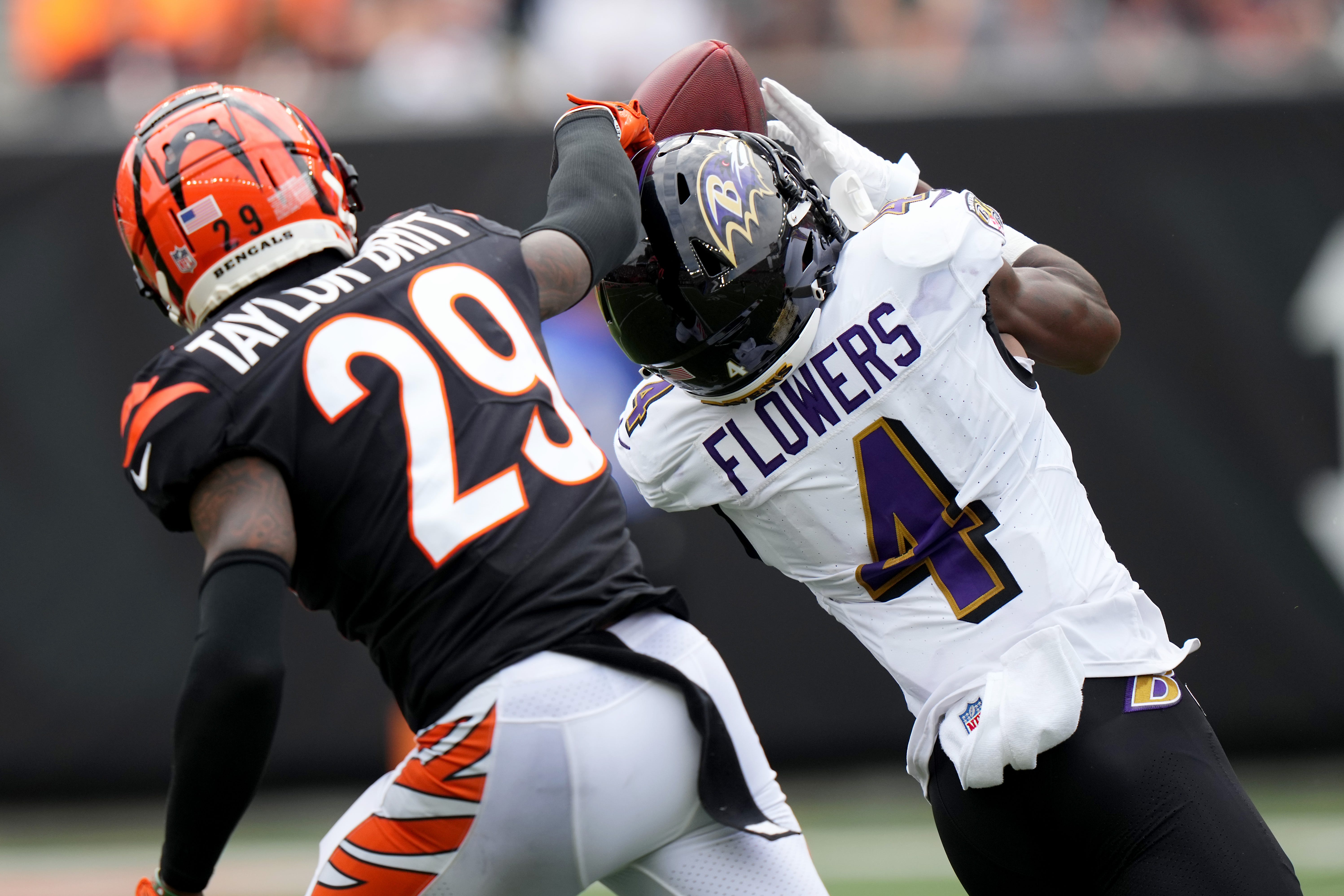 Baltimore Ravens wide receiver Zay Flowers (4) completes a catch as Cincinnati Bengals cornerback Cam Taylor-Britt (29) defends in the third quarter of a Week 2 NFL football game between the Baltimore Ravens and the Cincinnati Bengals Sunday, Sept. 17, 2023, at Paycor Stadium in Cincinnati.