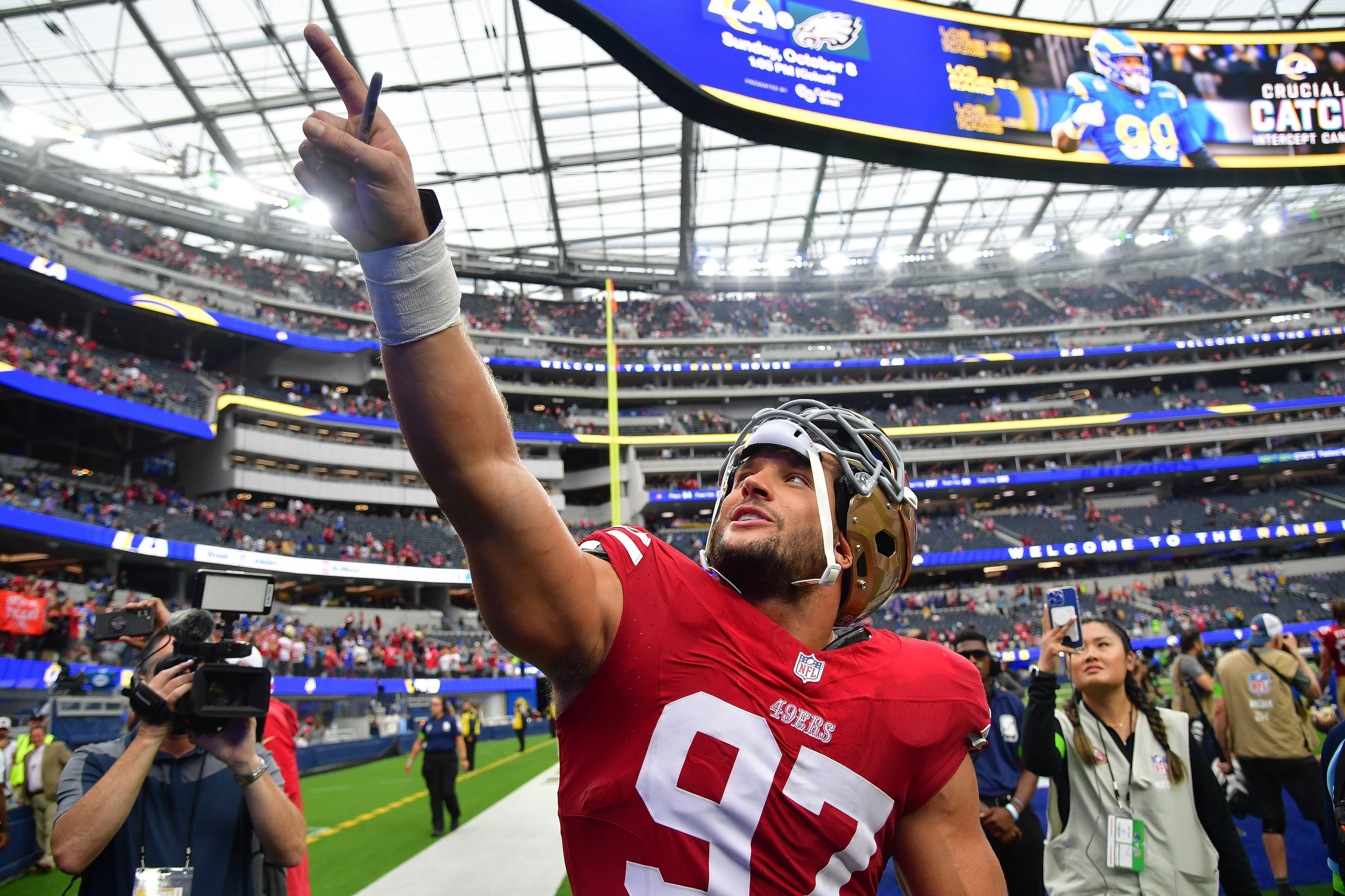 Sep 17, 2023; Inglewood, California, USA; San Francisco 49ers defensive end Nick Bosa (97) celebrates the victory against the Los Angeles Rams at SoFi Stadium. Mandatory Credit: Gary A. Vasquez-USA TODAY Sports