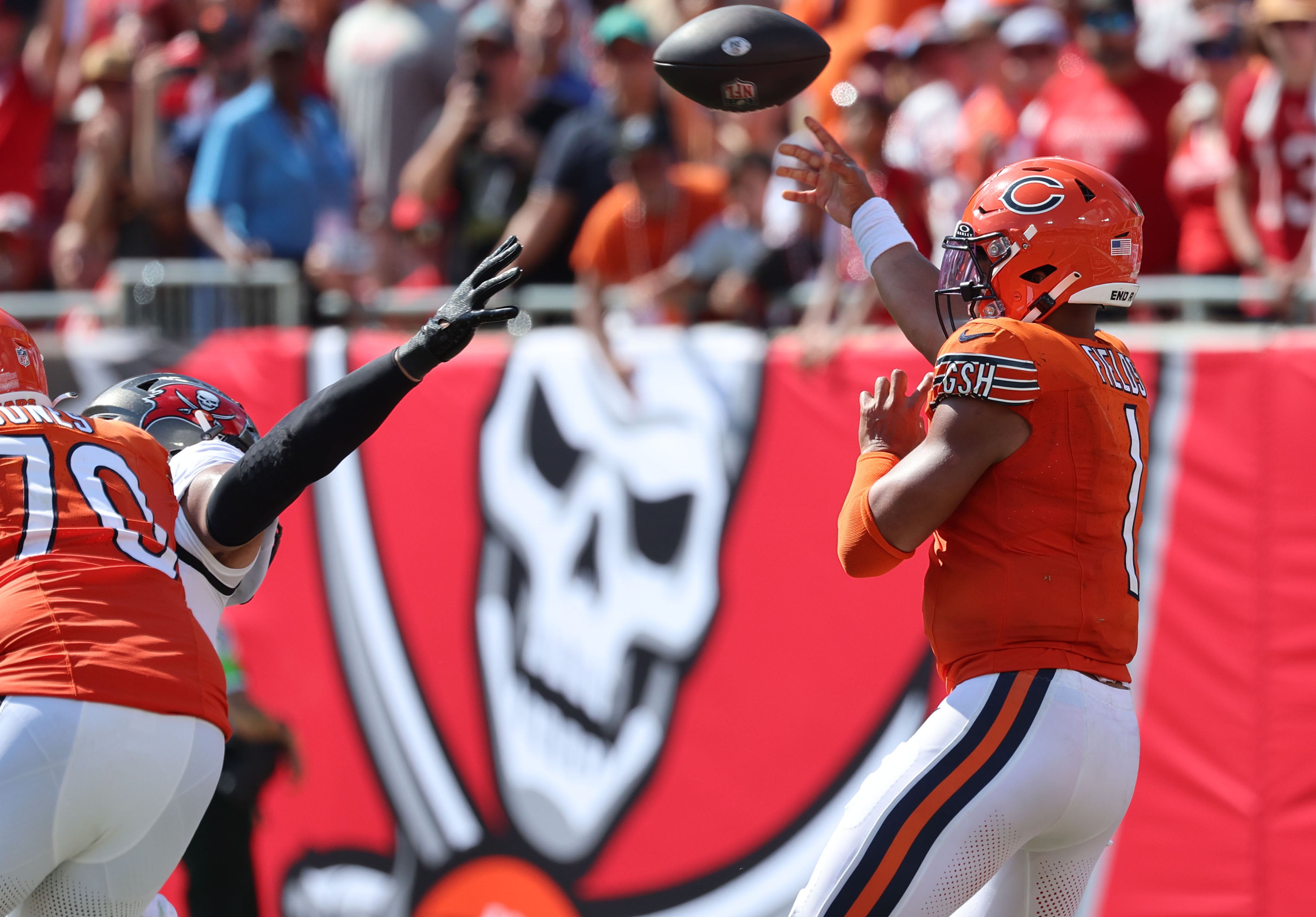 Sep 17, 2023; Tampa, Florida, USA; Chicago Bears quarterback Justin Fields (1) throws an interception against the Tampa Bay Buccaneers during the second half at Raymond James Stadium. Mandatory Credit: Kim Klement Neitzel-USA TODAY Sports