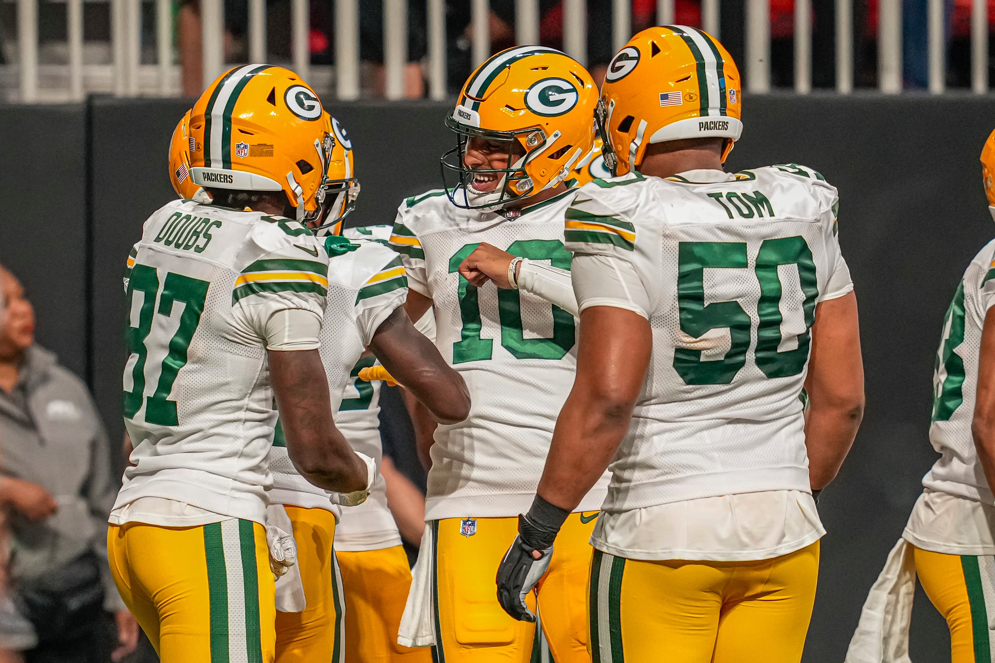 Sep 17, 2023; Atlanta, Georgia, USA; Green Bay Packers players react after a touchdown against the Atlanta Falcons during the second half at Mercedes-Benz Stadium. Mandatory Credit: Dale Zanine-USA TODAY Sport