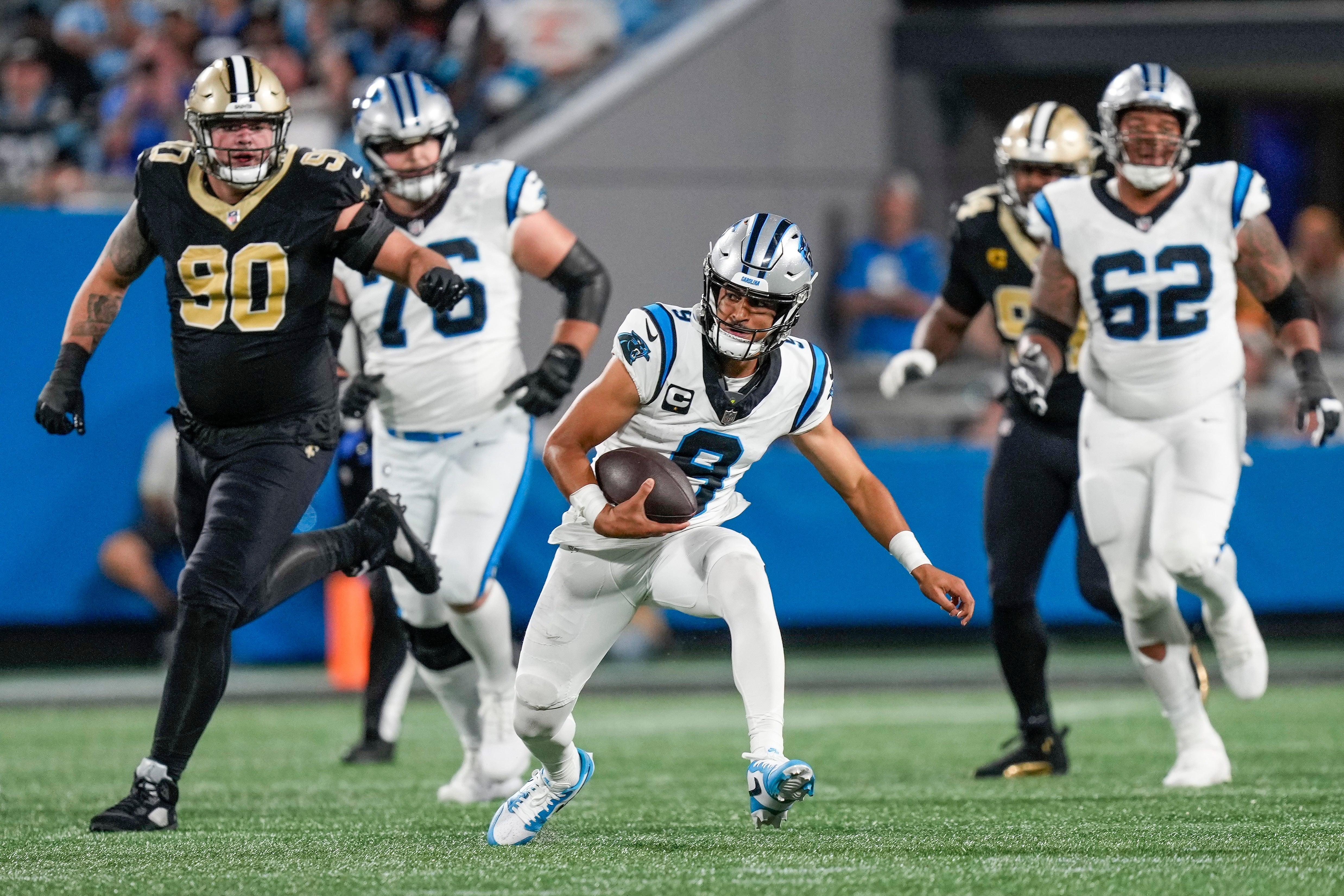 Sep 18, 2023; Charlotte, North Carolina, USA; Carolina Panthers quarterback Bryce Young (9) keeps the ball for a run against the New Orleans Saints during the second half at Bank of America Stadium. Mandatory Credit: Jim Dedmon-USA TODAY Sports