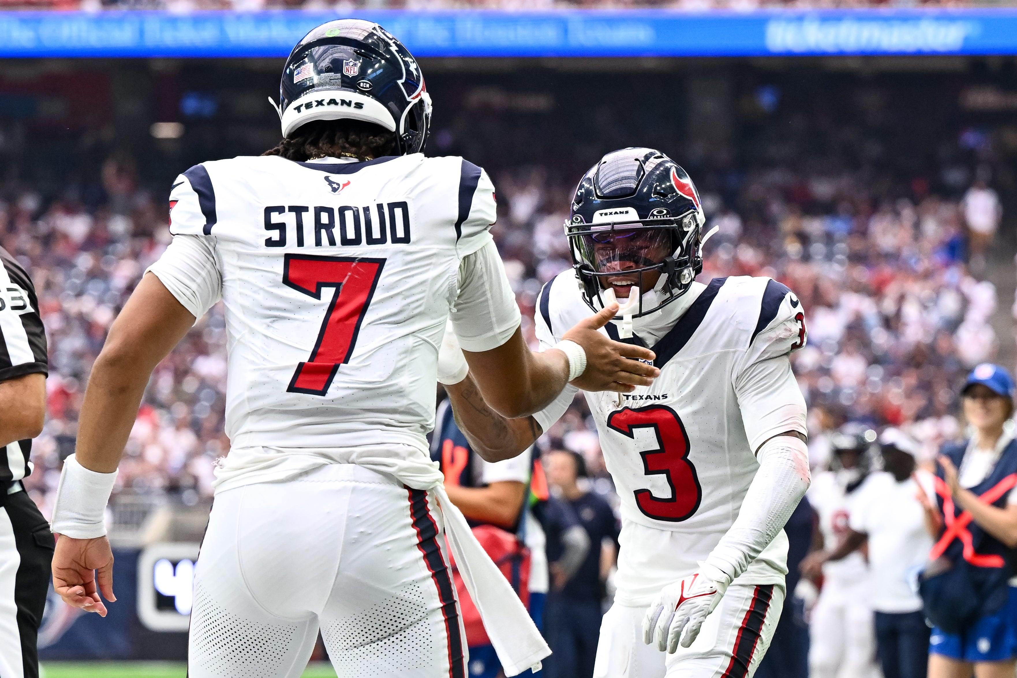 Sep 17, 2023; Houston, Texas, USA; Houston Texans quarterback C.J. Stroud (7) and wide receiver Tank Dell (3) celebrate during the second half against the Indianapolis Colts at NRG Stadium. Mandatory Credit: Maria Lysaker-USA TODAY Sports