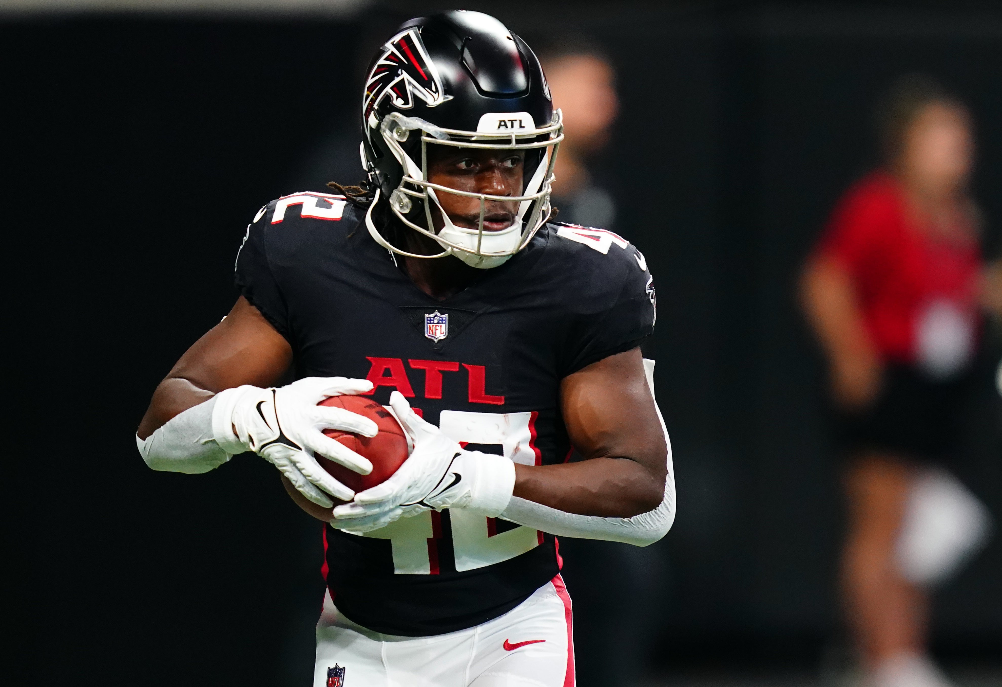 Aug 18, 2023; Atlanta, Georgia, USA; Atlanta Falcons running back Godwin Igwebuike (42) pulls down a catch during pregame warmups before their game against the Cincinnati Bengals at Mercedes-Benz Stadium. Mandatory Credit: John David Mercer-USA TODAY Sports
