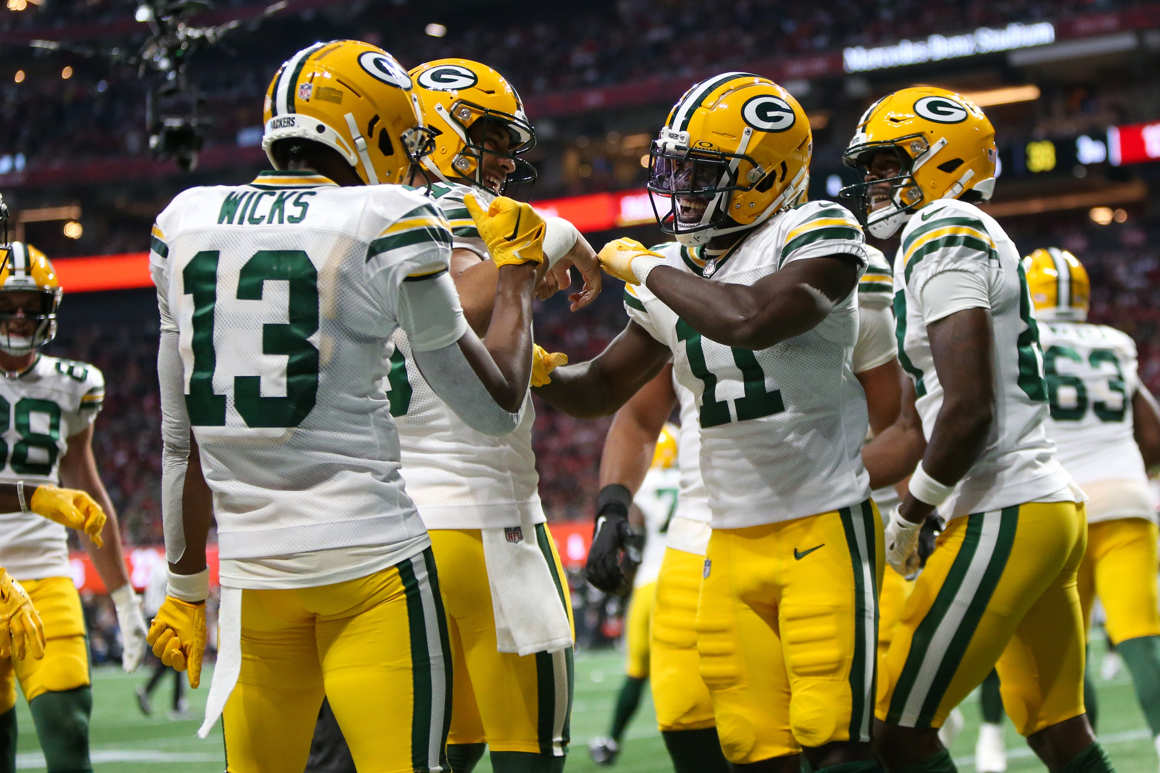 Sep 17, 2023; Atlanta, Georgia, USA; Green Bay Packers wide receiver Jayden Reed (11) celebrates with teammates after a touchdown against the Atlanta Falcons in the second half at Mercedes-Benz Stadium. Brett Davis-USA TODAY Sports