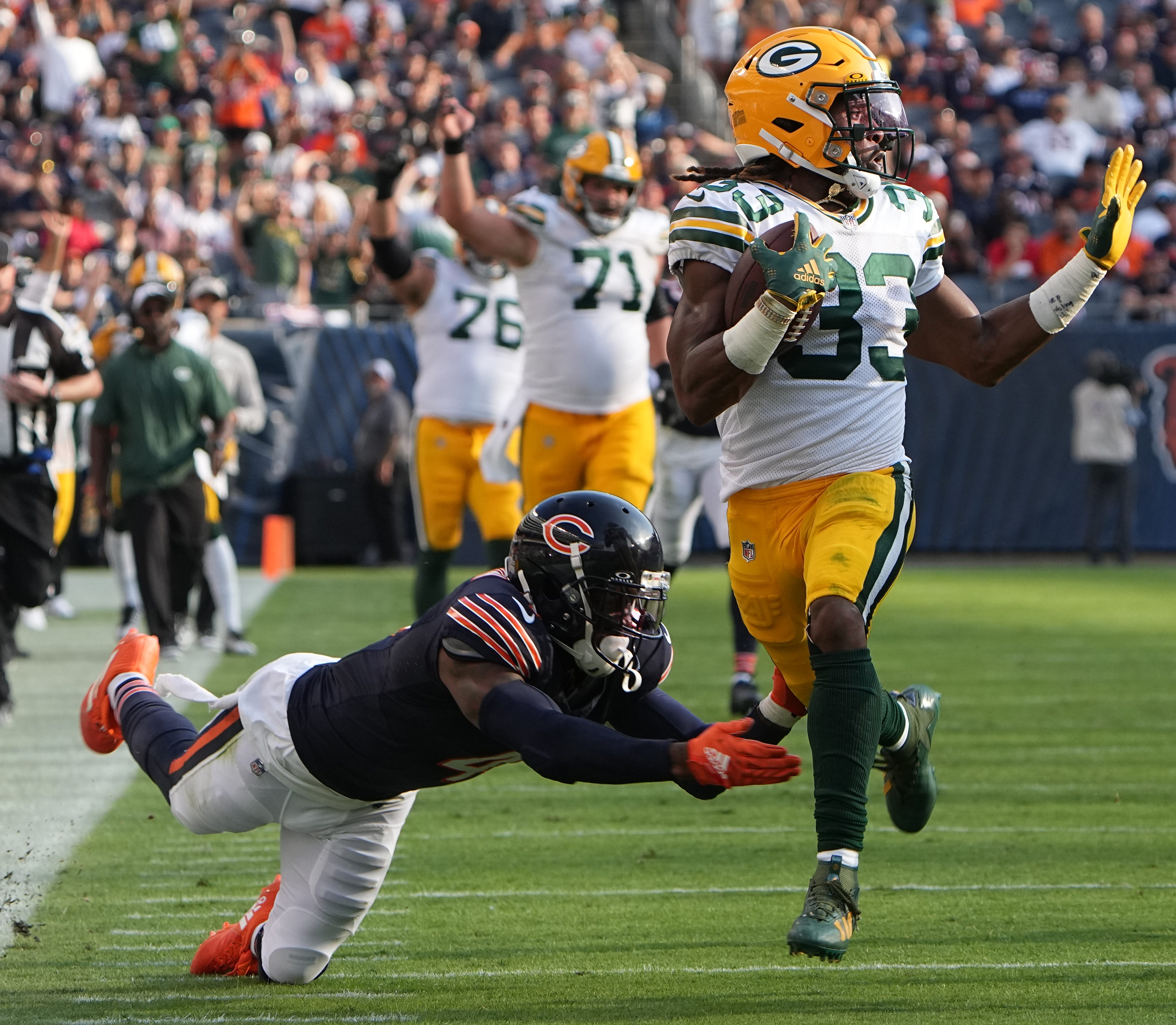 Green Bay Packers running back Aaron Jones (33) picks up 51 yards on reception while Chicago Bears safety Eddie Jackson (4) misses a tackle during the third quarter of their regular season opening game Sunday, September 10, 2023 at Soldier Field in Chicago, Ill. The Green Bay Packers beat the Chicago Bears 38-20. Mark Hoffman/Milwaukee Journal Sentinel / USA TODAY NETWORK