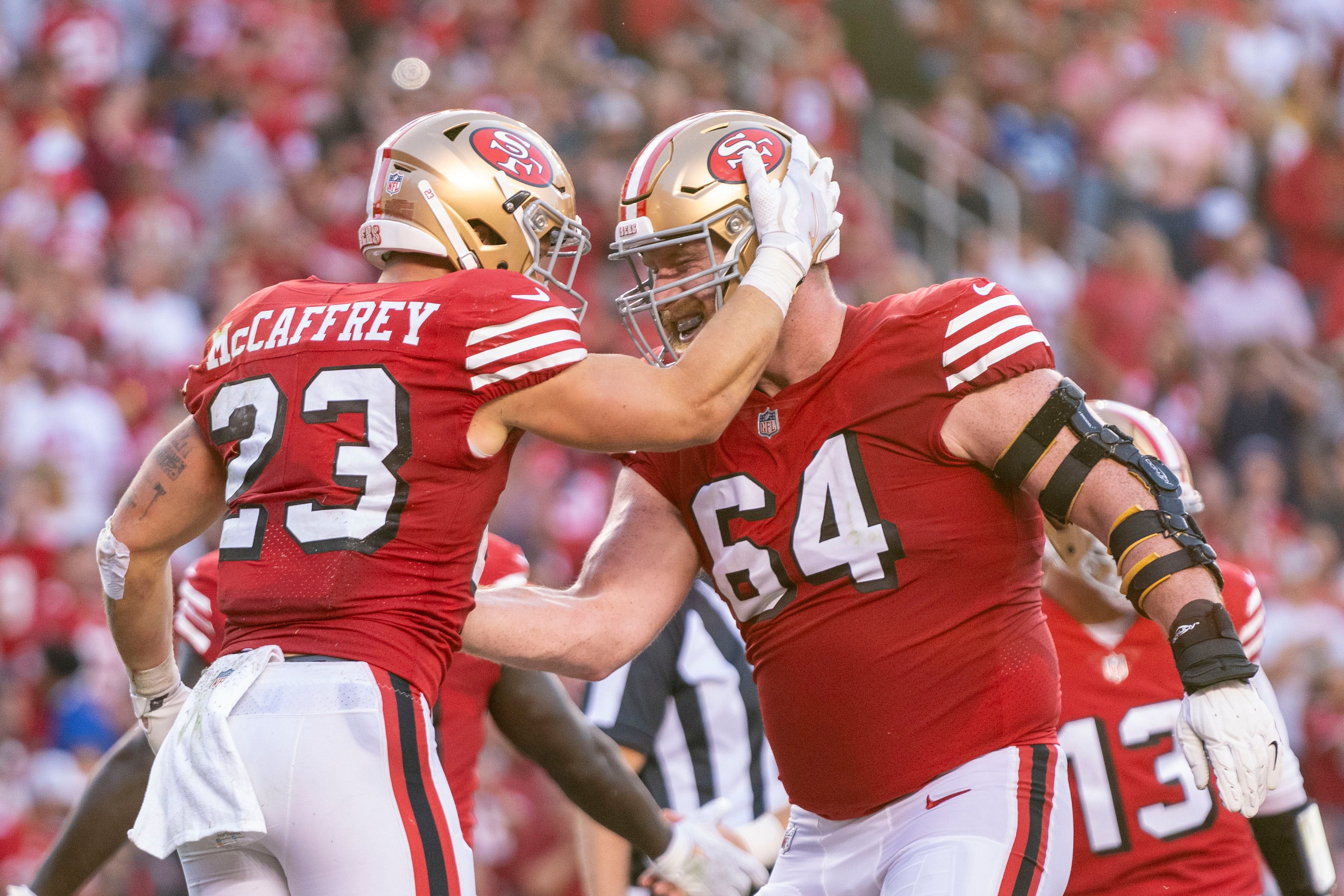 September 21, 2023; Santa Clara, California, USA; San Francisco 49ers running back Christian McCaffrey (23) is congratulated by center Jake Brendel (64) after scoring a touchdown against the New York Giants during the second quarter at Levi's Stadium. Mandatory Credit: Kyle Terada-USA TODAY Sports