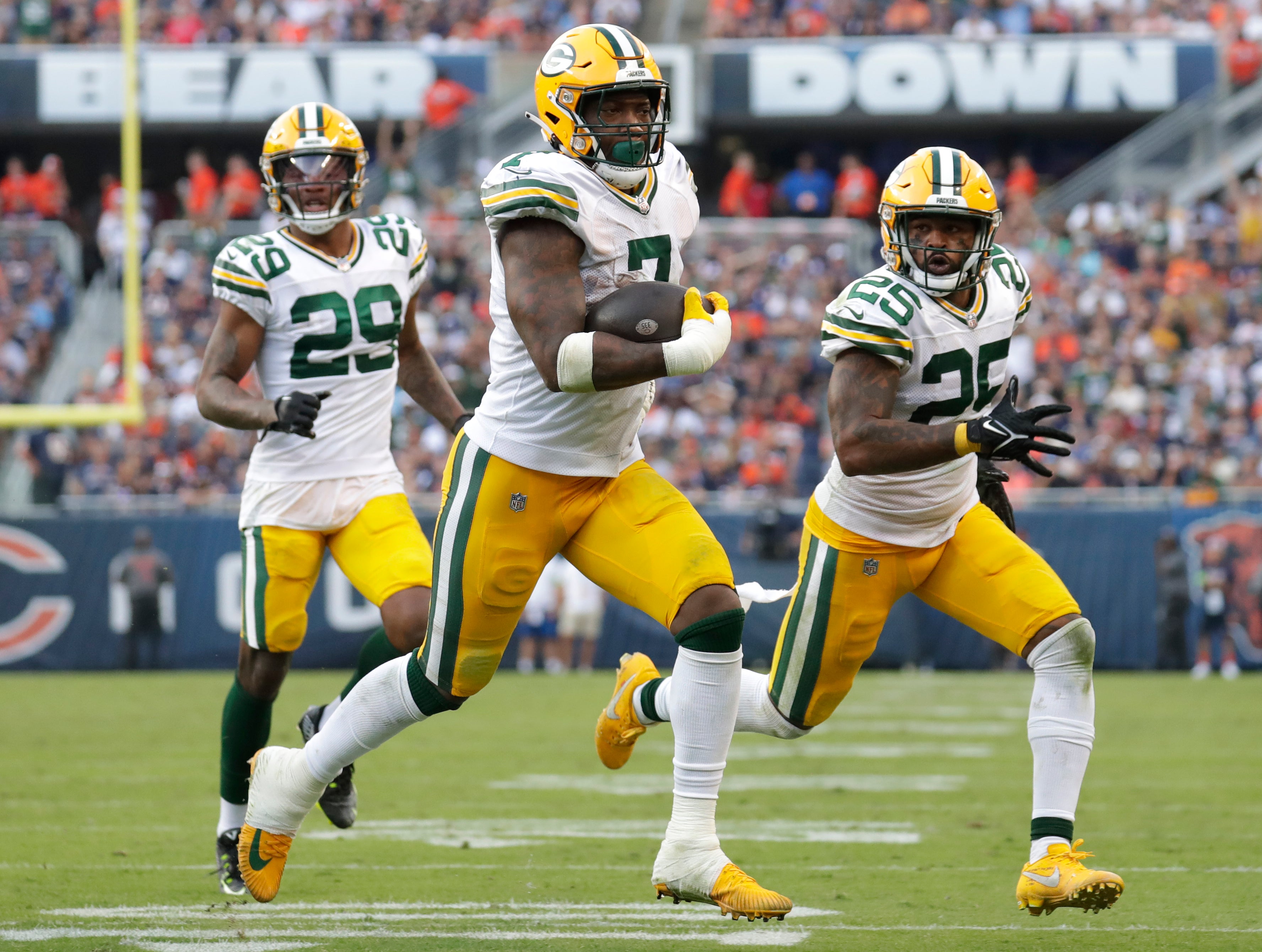 Sep 10, 2023; Chicago, Illinois, USA; Green Bay Packers linebacker Quay Walker (7) runs back an interception for a touchdown in the fourth quarter against the Chicago Bears at Soldier Field. Mandatory Credit: Dan Powers-USA TODAY Sports
