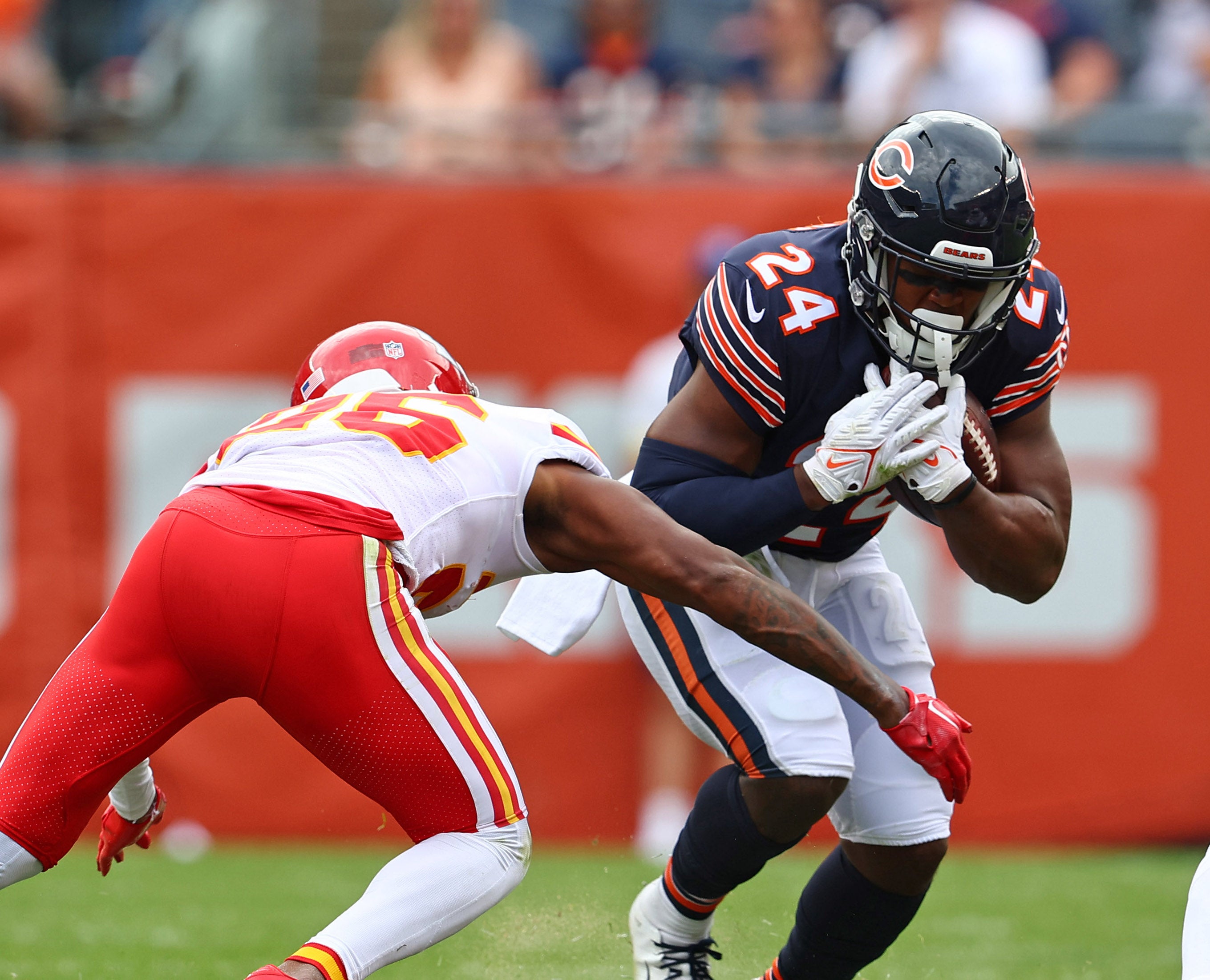 Aug 13, 2022; Chicago, Illinois, USA; Chicago Bears running back Khalil Herbert (24) rushes the ball against Kansas City Chiefs safety Deon Bush (26) during the first half at Soldier Field. Mandatory Credit: Mike Dinovo-USA TODAY Sports