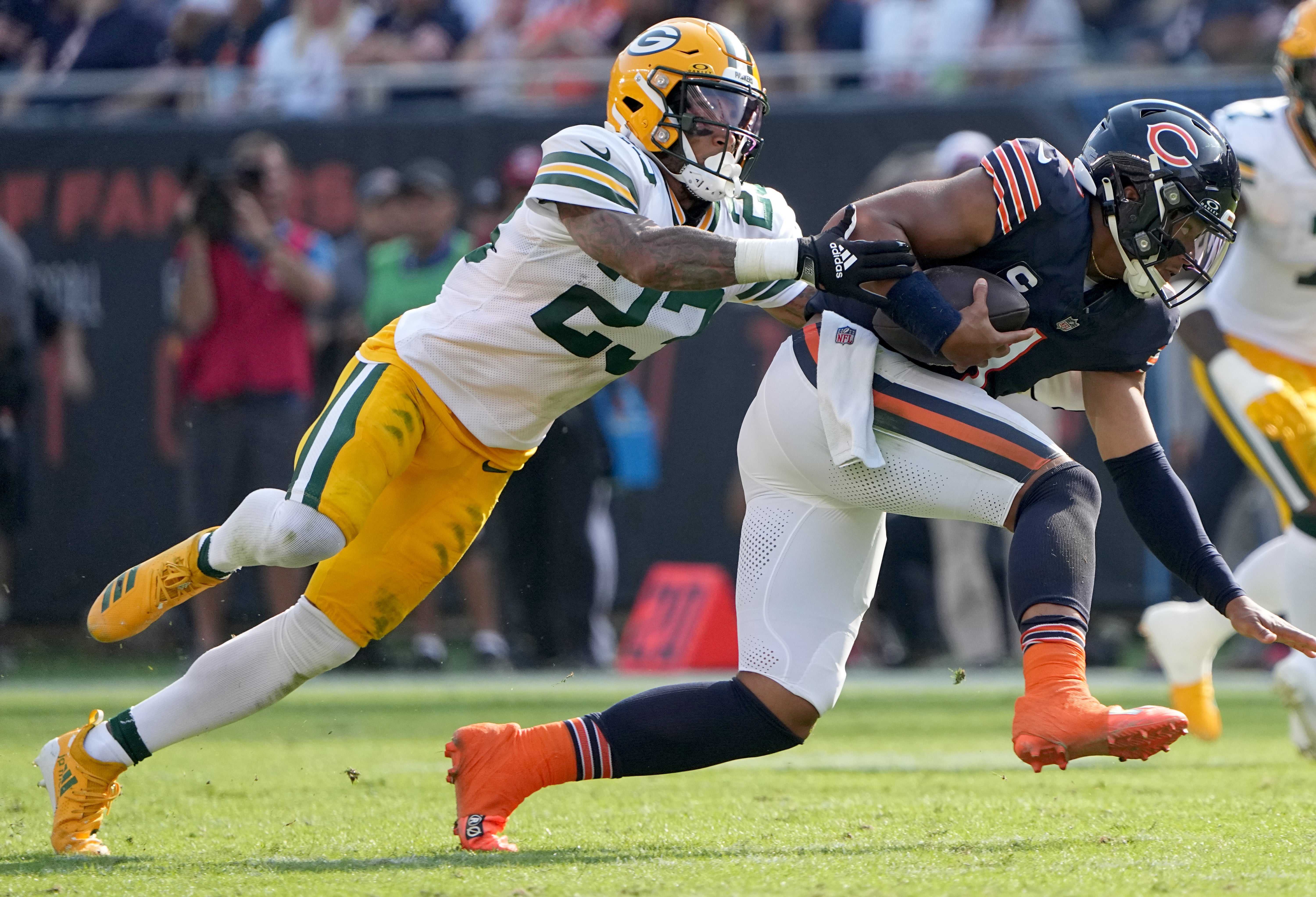 Sep 10, 2023; Chicago, Illinois, USA; Green Bay Packers cornerback Jaire Alexander (23) misses a would-be sack of Chicago Bears quarterback Justin Fields (1) during the second quarter of their regular season opening game at Soldier Field. Mandatory Credit: Mark Hoffman-USA TODAY Sports
