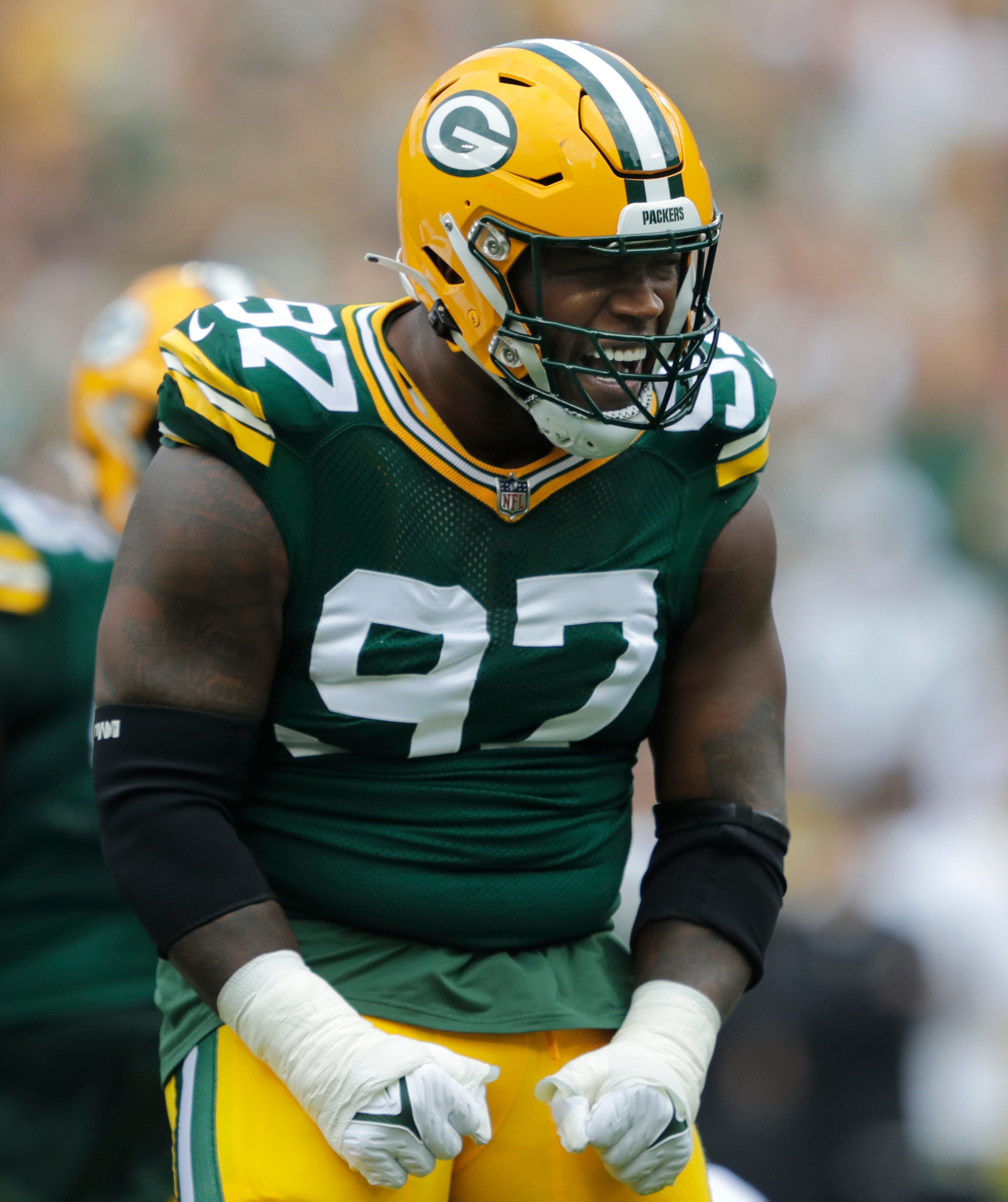 Green Bay Packers defensive tackle Kenny Clark (97) celebrates after sacking New Orleans Saints quarterback Derek Carr (4) in the first quarter during their football game Sunday, September 24, 2023, at Lambeau Field in Green Bay, Wis. Dan Powers/USA TODAY NETWORK-Wisconsin