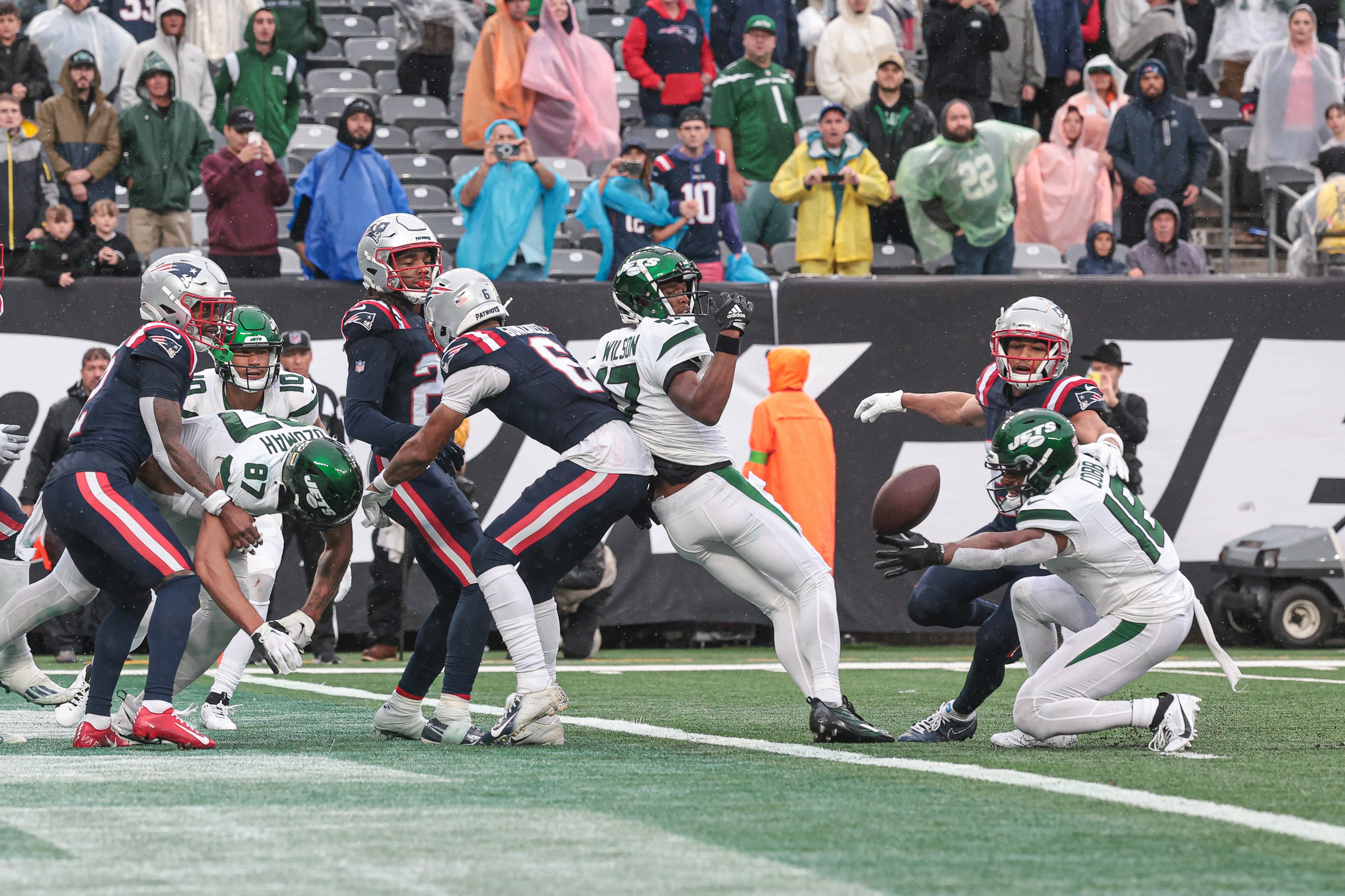 Sep 24, 2023; East Rutherford, New Jersey, USA; New York Jets wide receiver Randall Cobb (18) is unable to make a catch in front of New England Patriots defenders as time expires at MetLife Stadium. Mandatory Credit: Vincent Carchietta-USA TODAY Sports