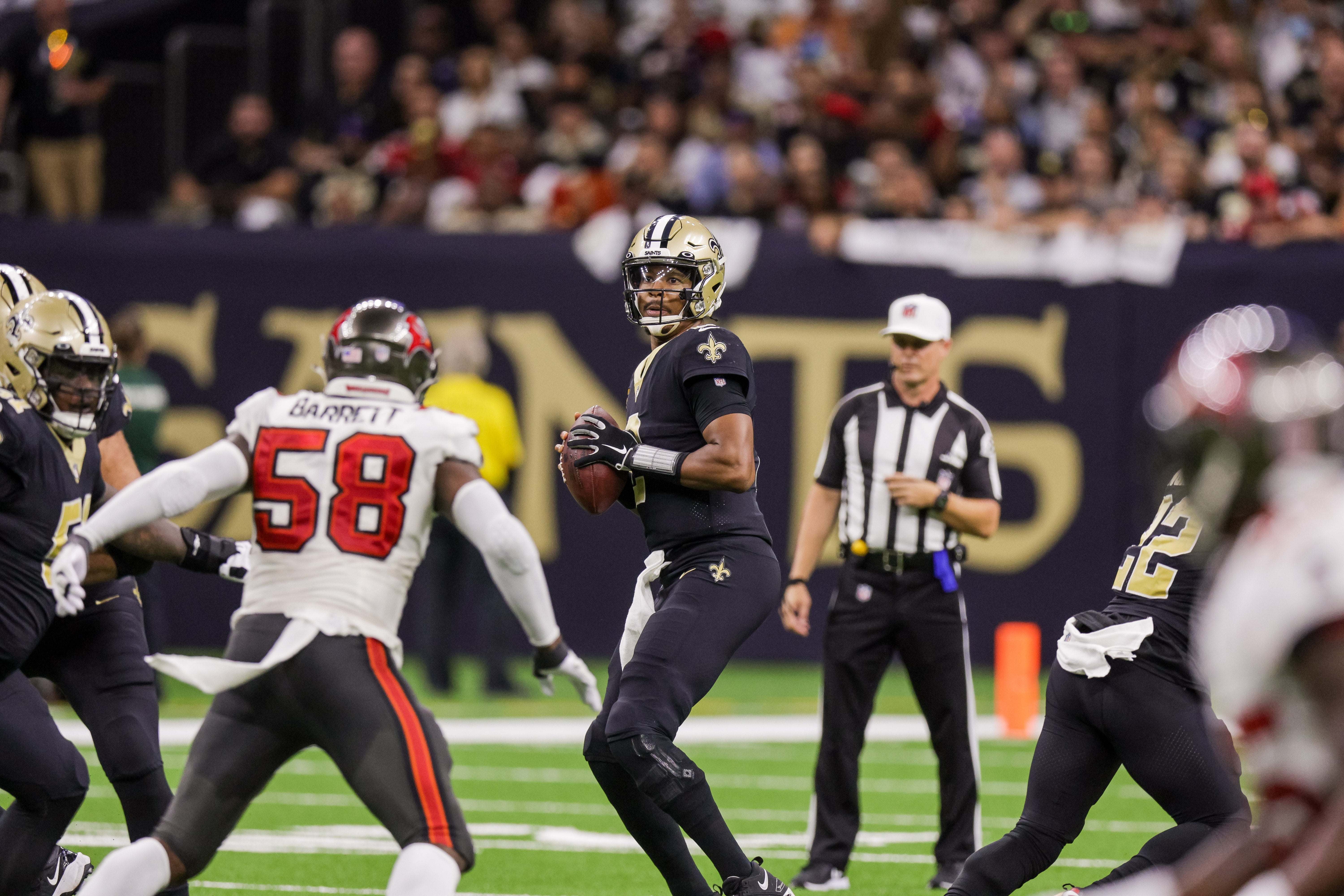 Sep 18, 2022; New Orleans, Louisiana, USA; New Orleans Saints quarterback Jameis Winston (2) looks to pass the ball against Tampa Bay Buccaneers linebacker Shaquil Barrett (58) during the first half at Caesars Superdome. Mandatory Credit: Stephen Lew-USA TODAY Sports